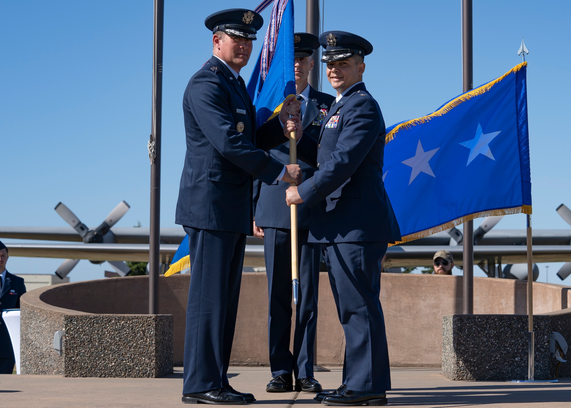 A photo of Lt. General David Krumm and Col. David Wilson posing with guidon