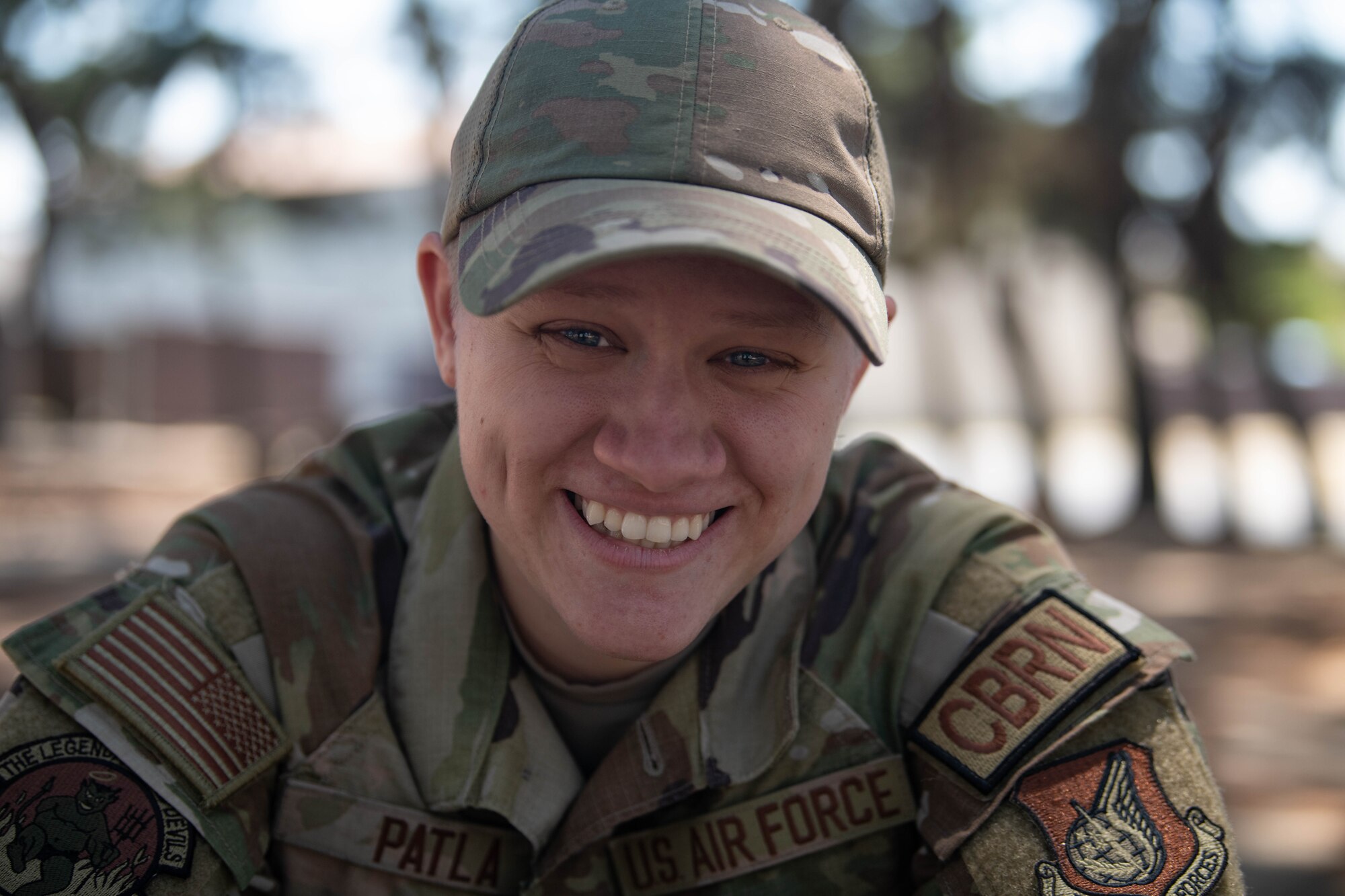 A military member smiles for the camera