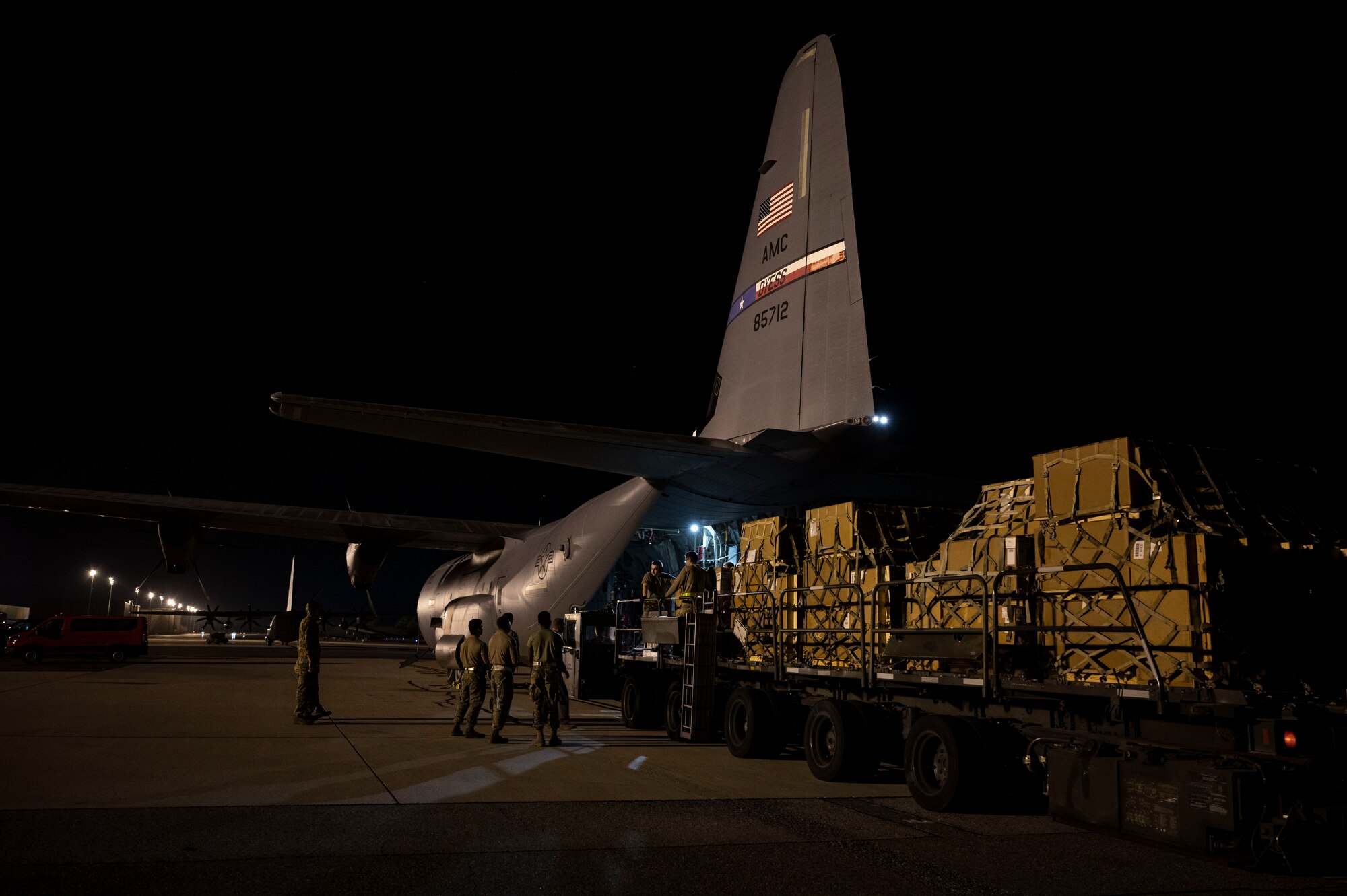 Airmen from the 436th Aerial Port Squadron assist in loading aircraft engine cargo onto a C-130J Super Hercules bound for Africa during a foreign military sales mission at Dover Air Force Base, Delaware, June 24, 2022. The United States and its African partners have a shared interest in a secure, stable, and prosperous African continent. Due to its strategic location, Dover AFB supports approximately $3.5 billion worth of foreign military sales annually. (U.S. Air Force photo by Staff Sgt. Marco A. Gomez)