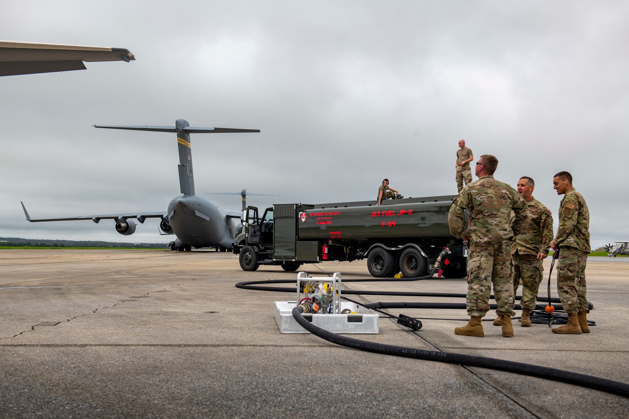 Air Force Airmen from the 18th Logistics Readiness Squadron work alongside Airmen from McConnell Air Force Base’s Agile Combat Employment office to hot pit refuel a KC-46 Pegasus