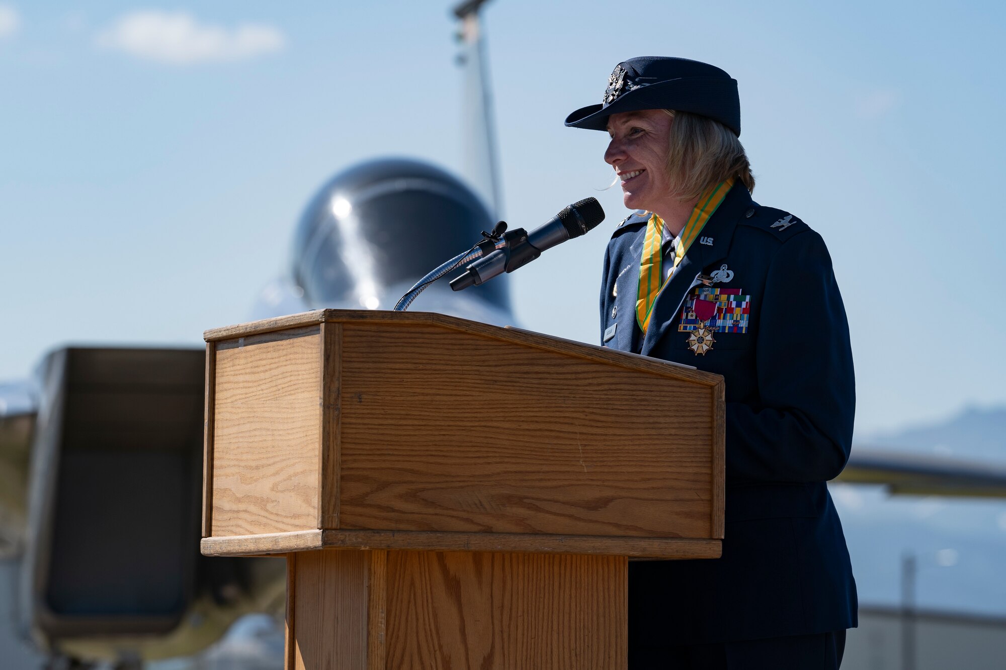 A photo of Col. Kirsten Aguilar speaking during the 673d ABW change of command ceremony