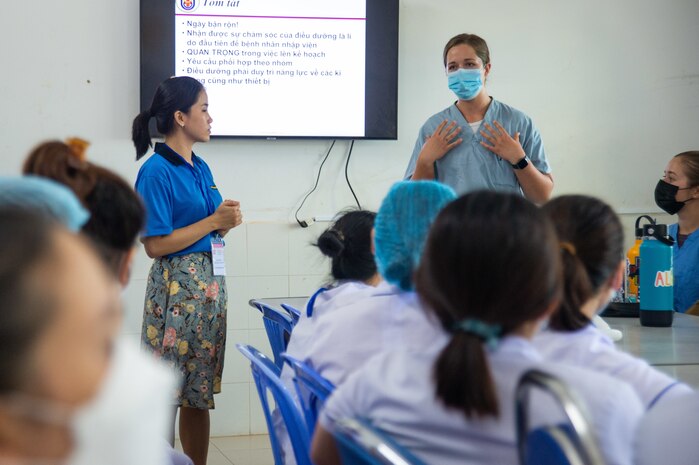 Lt. Kimberly Kozlowski, a U.S. Navy ICU nurse from Saline, Michigan, presents information on mechanical ventilators during a subject matter expert exchange event with Vietnamese nurses at Phu Yen General Hospital in support of Pacific Partnership 2022.