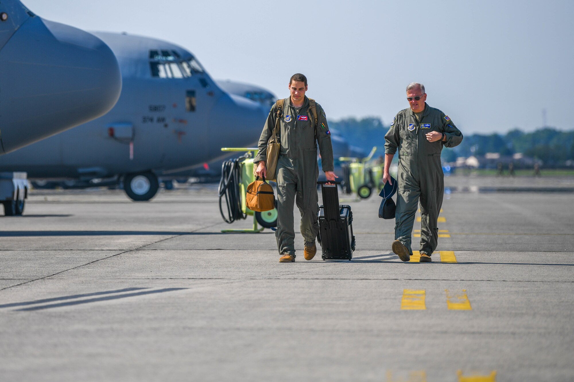 C-130J Pilots walk down a fightline