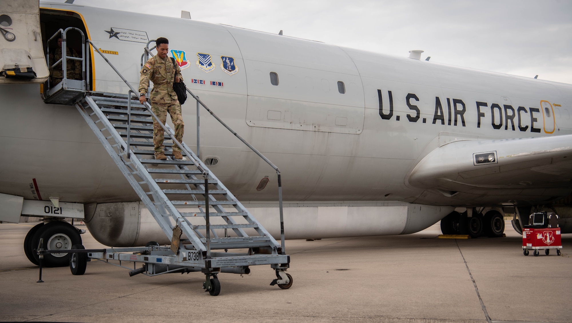 U.S. Army Staff Sgt. Brandon McGowan, 138th Military Intelligence Company Joint Surveillance Target Attack Radar System aircraft crew member, exits an E-8C JSTARS for the last time at Ramstein Air Base, Germany, June 22, 2022. Army personnel have worked as liaisons for the JSTARS since 1994, providing a bridge between air and ground forces. Due to the deactivation of the 138th Military Intelligence Company, Army personnel will no longer work alongside the JSTARS. (U.S. Air Force photo by Airman 1st Class Jared Lovett)