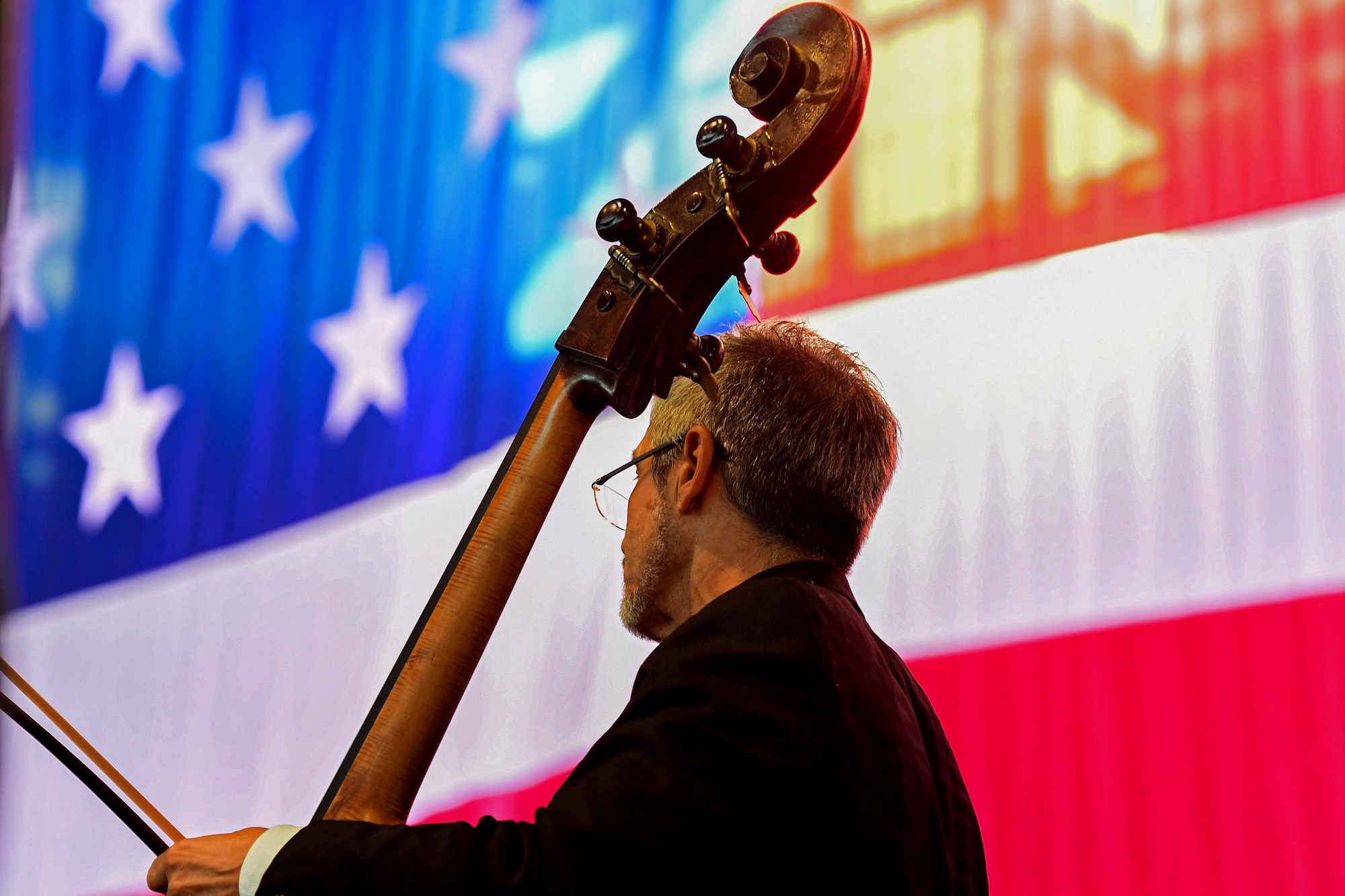 U.S. Air Force Brig. Gen. Jason Bailey, 31st Fighter Wing Commander, speaks at the Chamber Orchestra “Nuova Orchestra da Camera Ferruccio Busoni” concert at Aviano Air Base, Italy, June 29, 2022. They were directed by Maestro Massimo Belli and performed “Melodies of the Century”. The goal of these events is to bring two nations together through music, international language and a sense of community. (U.S. Air Force photo by Senior Airman Noah Sudolcan)