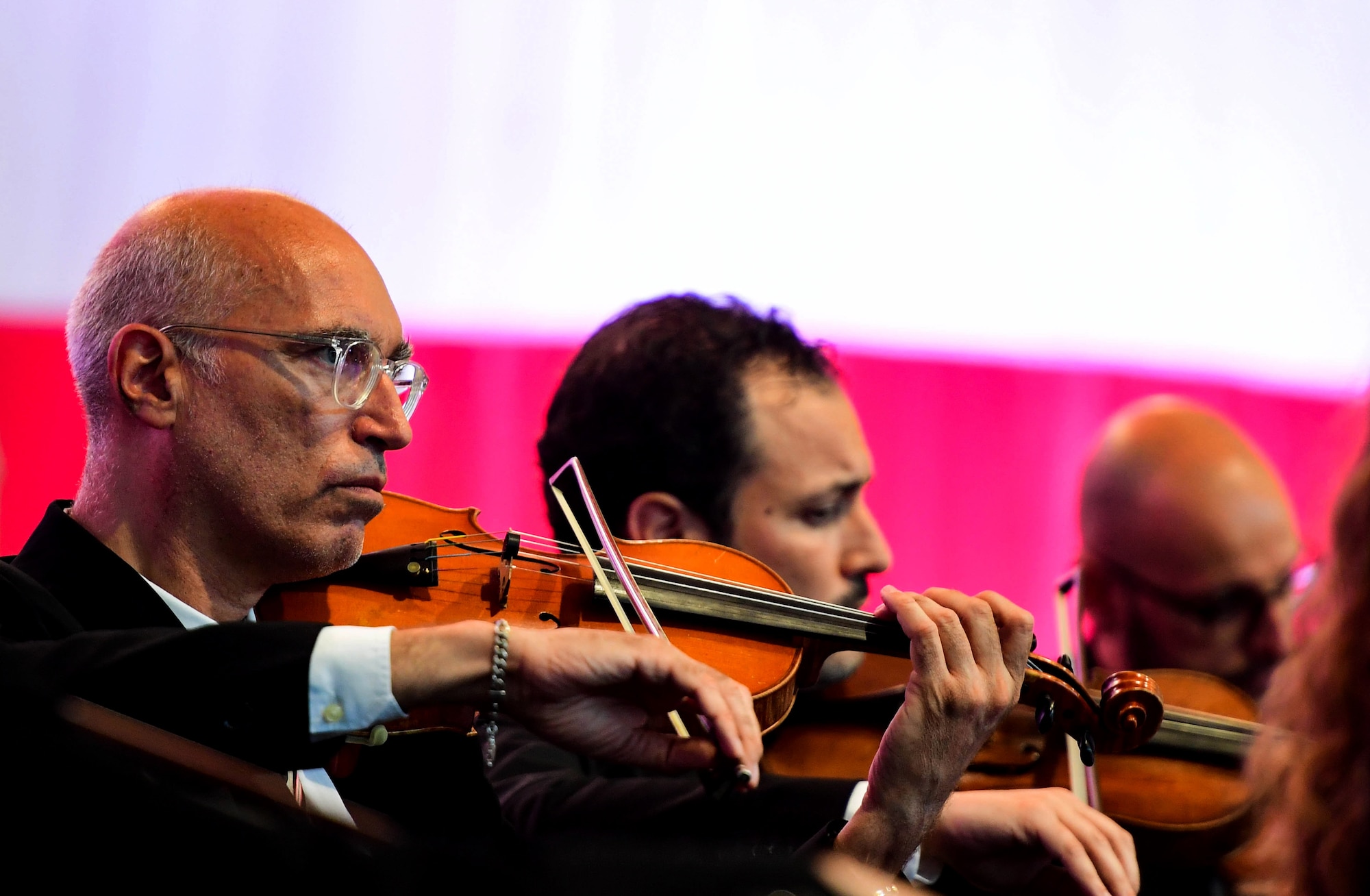 U.S. Air Force Brig. Gen. Jason Bailey, 31st Fighter Wing Commander, speaks at the Chamber Orchestra “Nuova Orchestra da Camera Ferruccio Busoni” concert at Aviano Air Base, Italy, June 29, 2022. They were directed by Maestro Massimo Belli and performed “Melodies of the Century”. The goal of these events is to bring two nations together through music, international language and a sense of community. (U.S. Air Force photo by Senior Airman Noah Sudolcan)