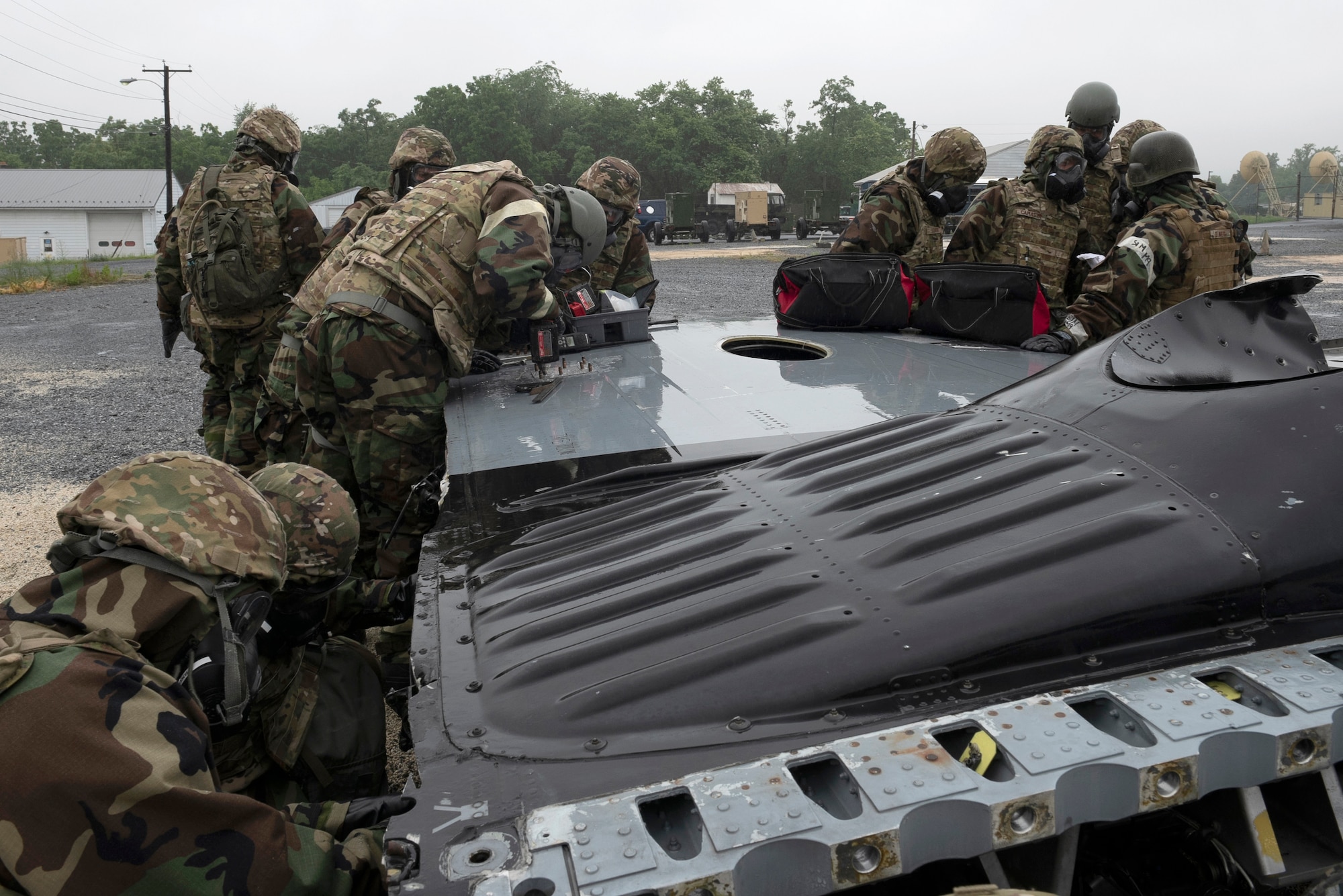 193rd Special Operations Aircraft Maintenance Squadron Airmen from Middletown, Pennsylvania Air National Guard, assess battle damage to a wing of a C-130 during a training exercise held at Fort Indiantown Gap, Annville, Pennsylvania June 23, 2022.