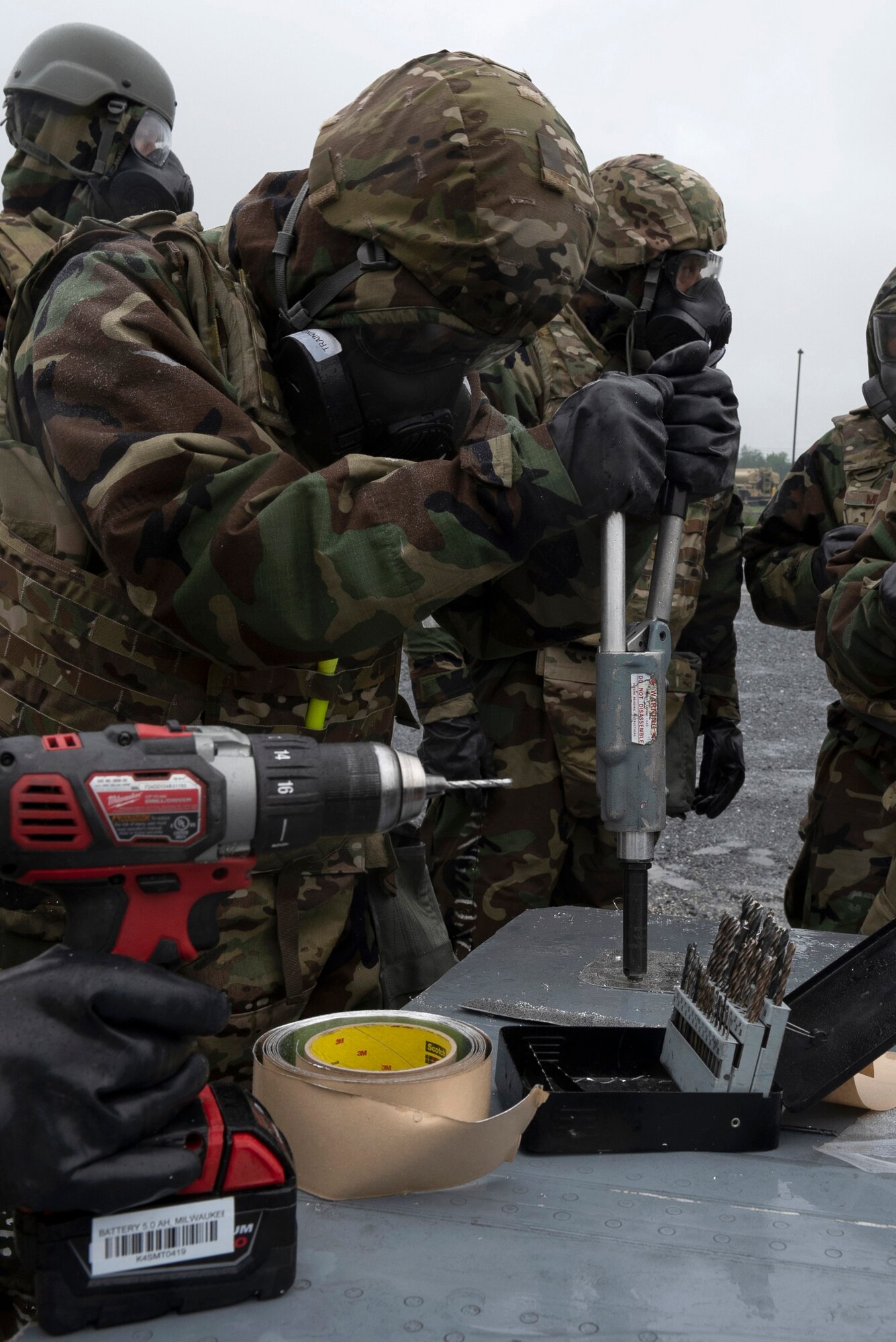 193rd Special Operations Aircraft Maintenance Squadron Airmen from Middletown, Pennsylvania Air National Guard, place rivets into a metal patch on a C-130 wing to repair a hole during a training exercise held at Fort Indiantown Gap, Annville, Pennsylvania June 23, 2022.