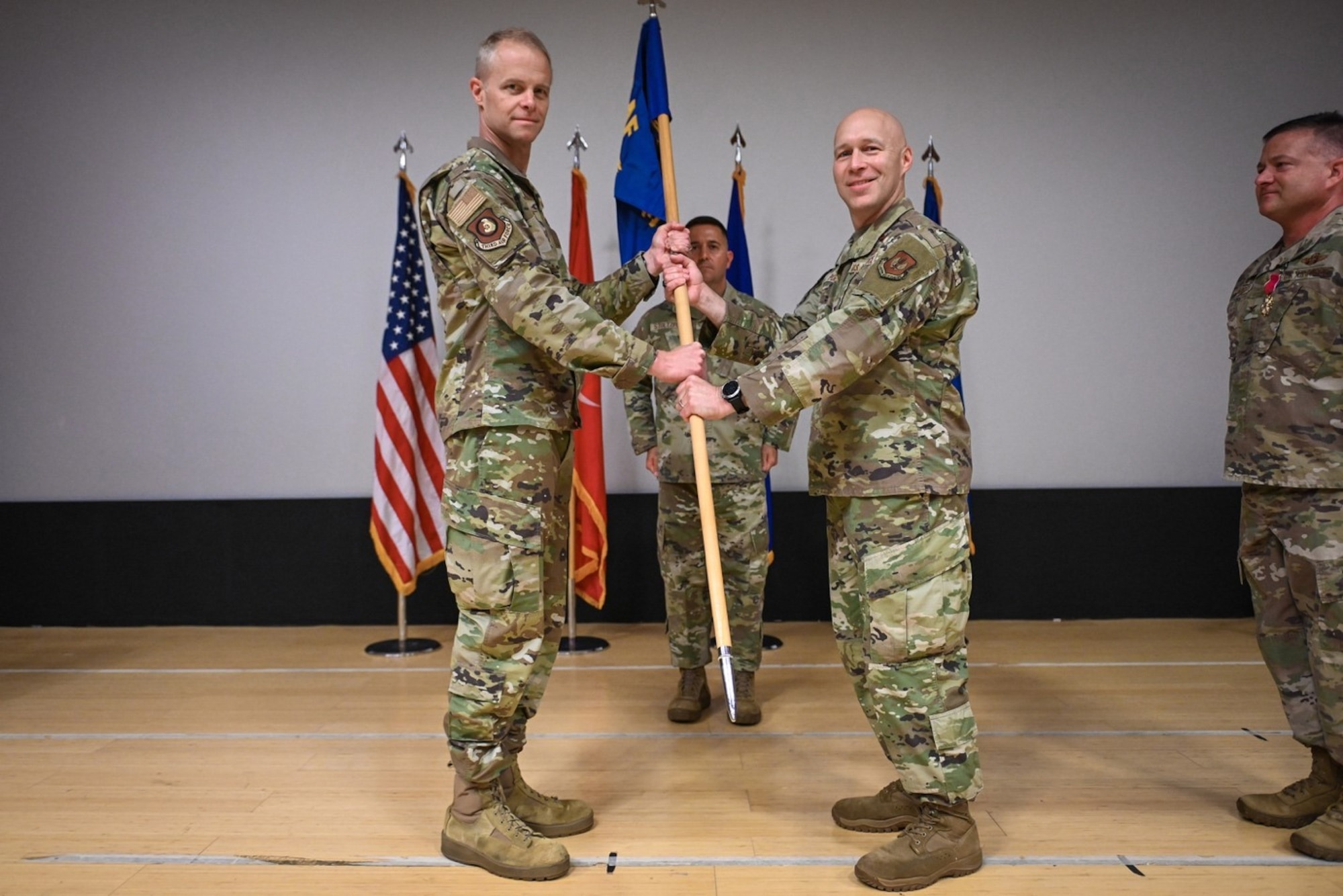 Maj. Gen. Derek France (left), Third Air Force commander, presents the guidon to Col. Calvin Powell, incoming 39th Air Base Wing commander, during a change of command ceremony at Incirlik Air Base, Turkey, June 30, 2022. Powell replaced Col. Jason Gingrich as 39th ABW commander after serving as the vice commander of the 435th Air Ground Operations Wing and 435th Air Expeditionary Wing, at Ramstein AB, Germany. The 39th ABW is charged with defending NATO’s southern flank under the auspices of 3rd AF, U.S. Air Forces in Europe – Air Forces Africa and U.S. European Command. The wing projects global power through strategic deterrence, agile combat support and enduring partnerships to defend U.S. interests and allies. (U.S. Air Force photo by Senior Airman Joshua T. Crossman)