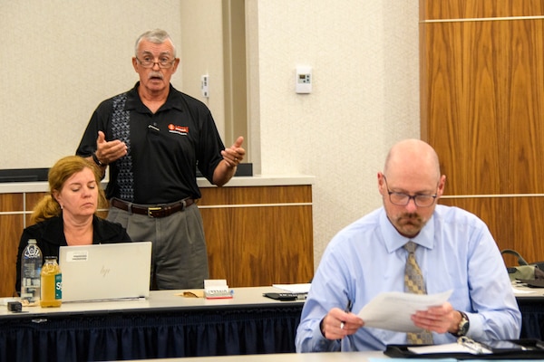 D. Michael Hinkley, senior investigor for Commander, Navy Installations Command (CNIC) Inspector General's Office, speaks at the annual CNIC Office of the Inspector General Symposium.