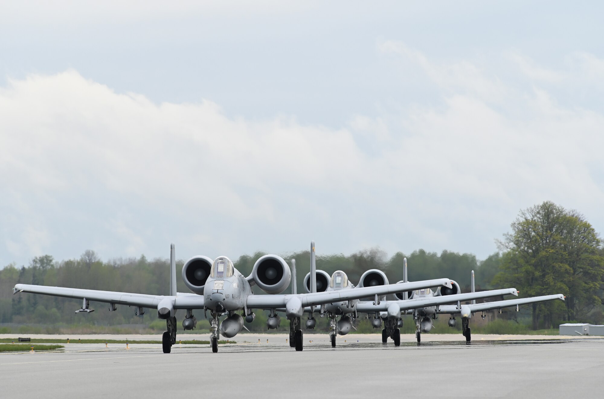 Three A-10C Thunderbolt II aircraft assigned to the 104th Fighter Squadron, Maryland Air National Guard, arrive at Lielvārde Air Base, located in the Vidzeme region of Latvia, May 14, 2022, for agile combat employment training during DEFENDER-Europe 22.