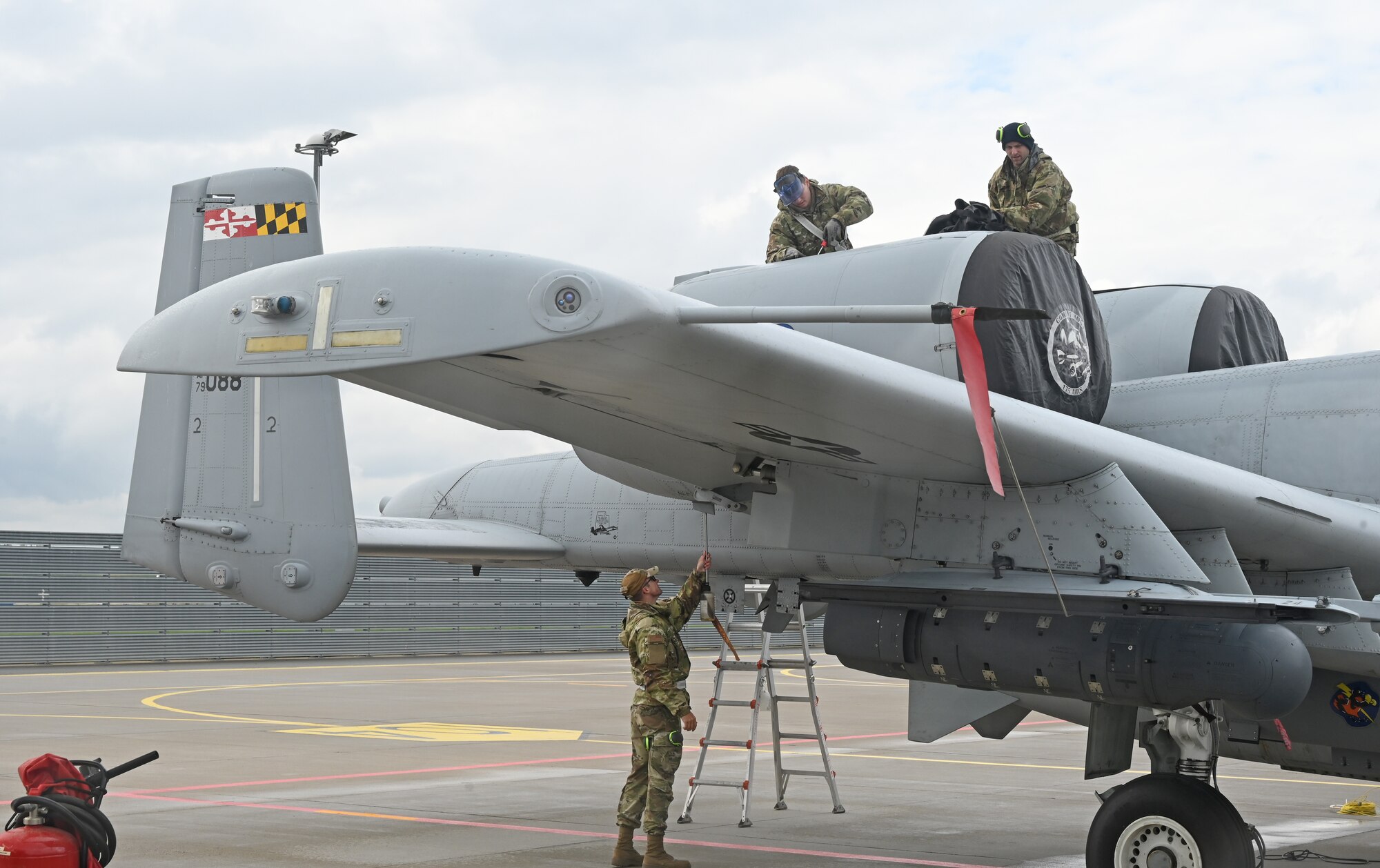 Airmen assigned to the 175th Aircraft Maintenance Squadron and 175th Maintenance Squadron, Maryland Air National Guard, inspect an A-10C Thunderbolt II aircraft after arrival at Lielvārde Air Base, located in the Vidzeme region of Latvia, May 14, 2022, for support and training while participating in DEFENDER-Europe 22.