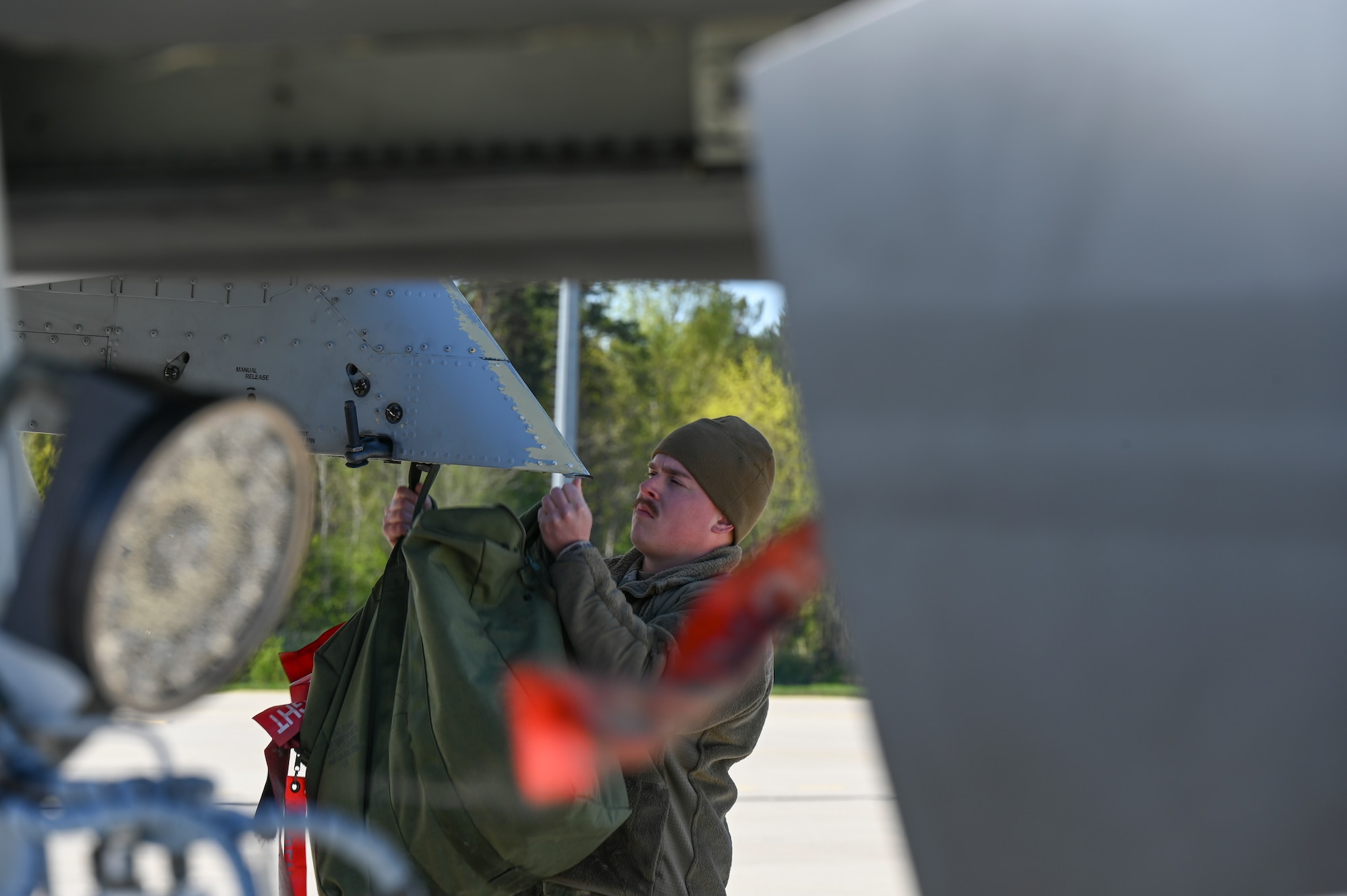 U.S. Air Force Airman Andrew Boenig, a flightline crew chief assigned to the 175th Aircraft Maintenance Squadron, Maryland Air National Guard, prepares to send off an A-10C Thunderbolt II aircraft for flight in support of the DEFENDER-Europe 22 exercise, May 18, 2022, at Ämari Air Base, Estonia.