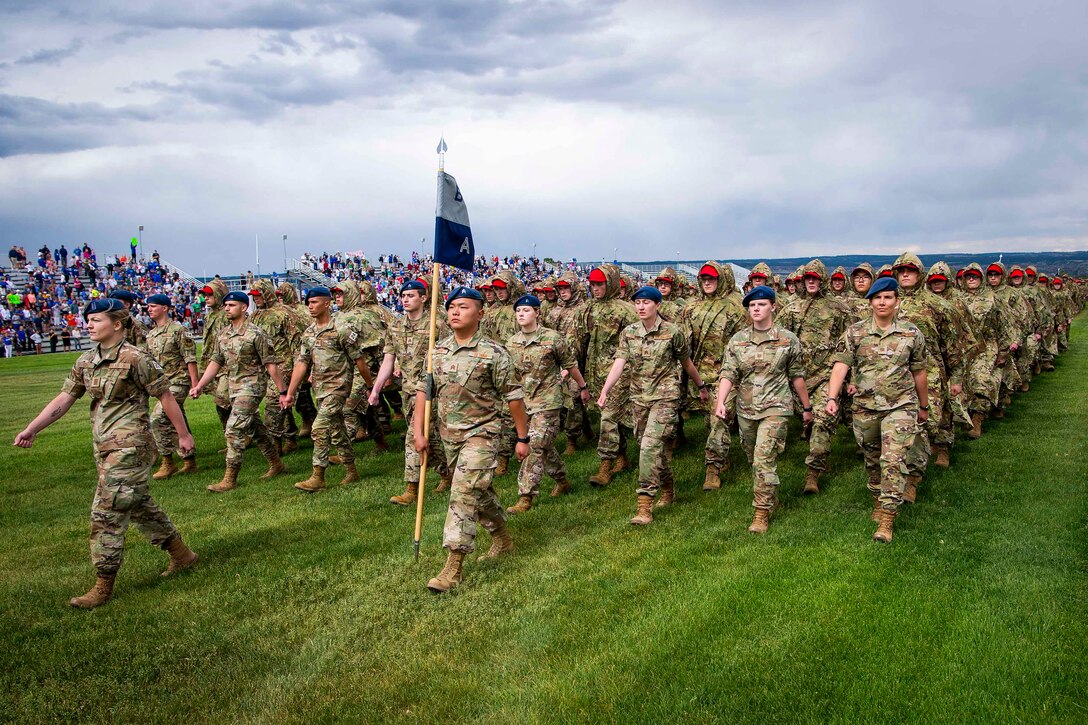 A group of Air Force cadets march in formation.