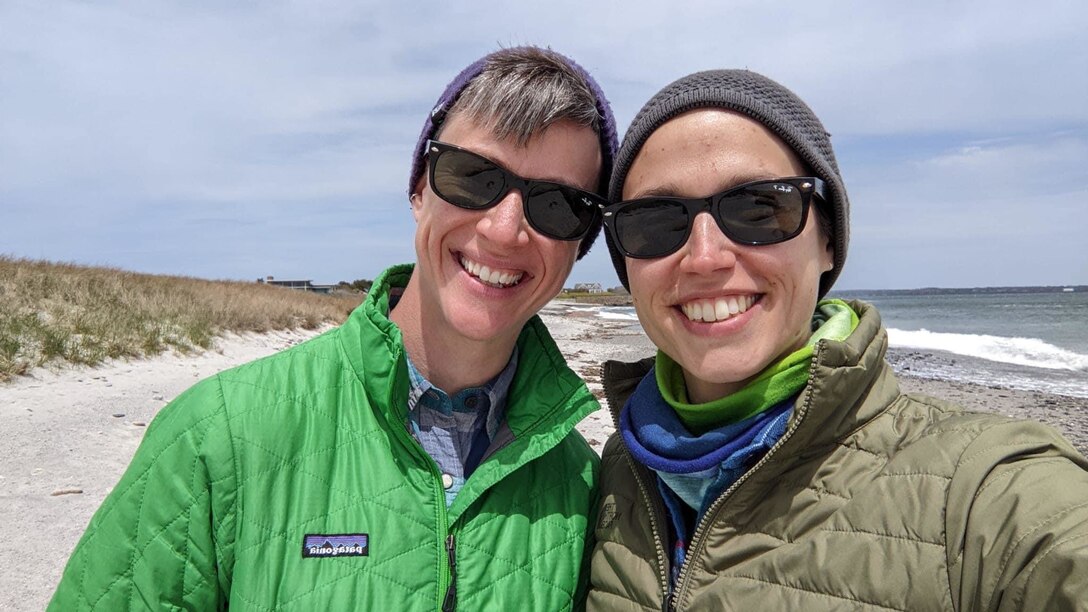 Capt. Shannon Woodman, a civil affairs officer with the 443rd Civil Affairs Battalion located in Newport, Rhode Island, poses for a photo with her fiancée, Stefi, on beach in Rhode Island.