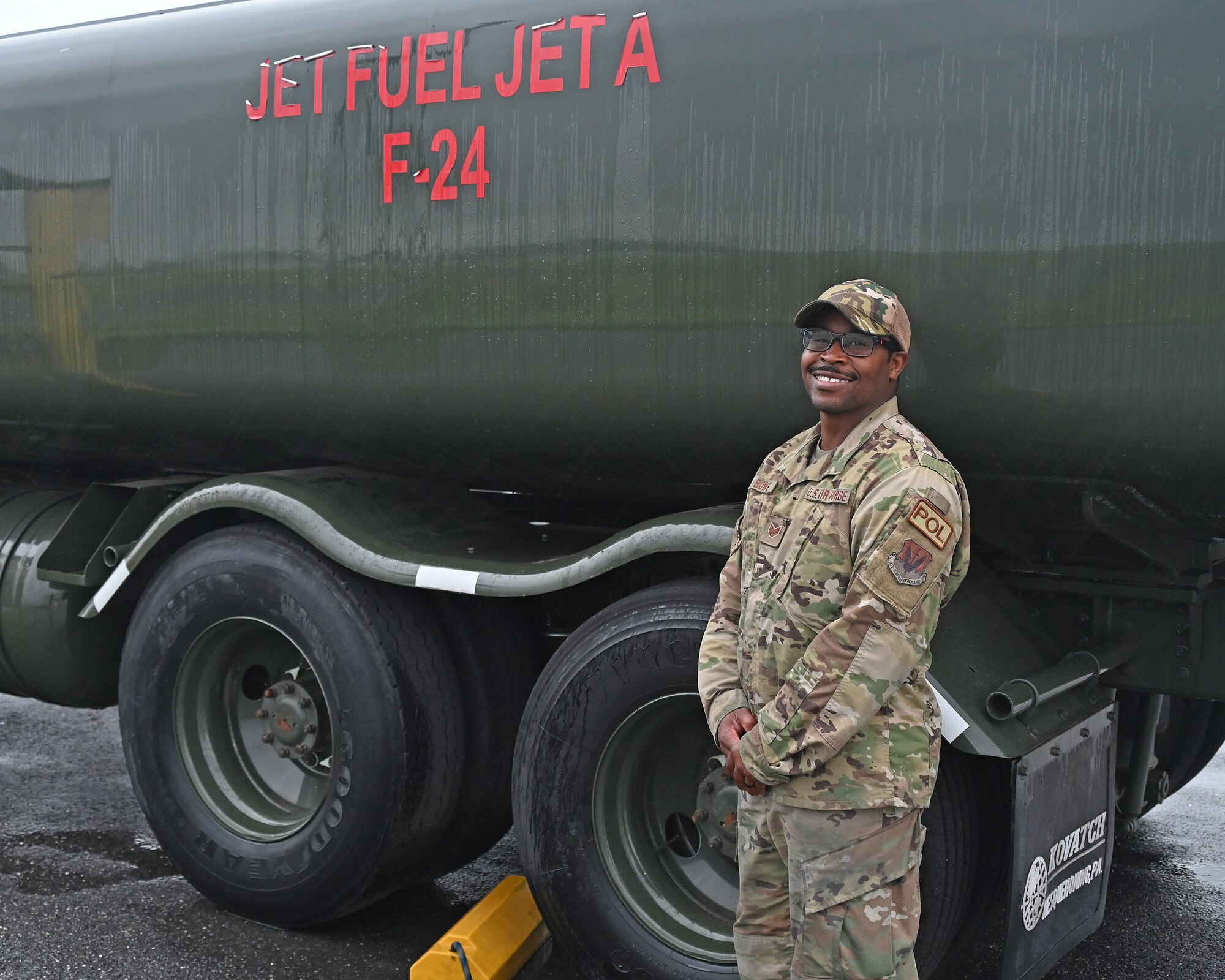 U.S. Air Force Staff Sgt. Terence Bowe, a fuels craftsman assigned to the 175th Mission Support Group, Maryland Air National Guard, poses for a photograph next to a fuel truck at Warfield Air National Guard Base, Middle River, Md., June 23, 2022.