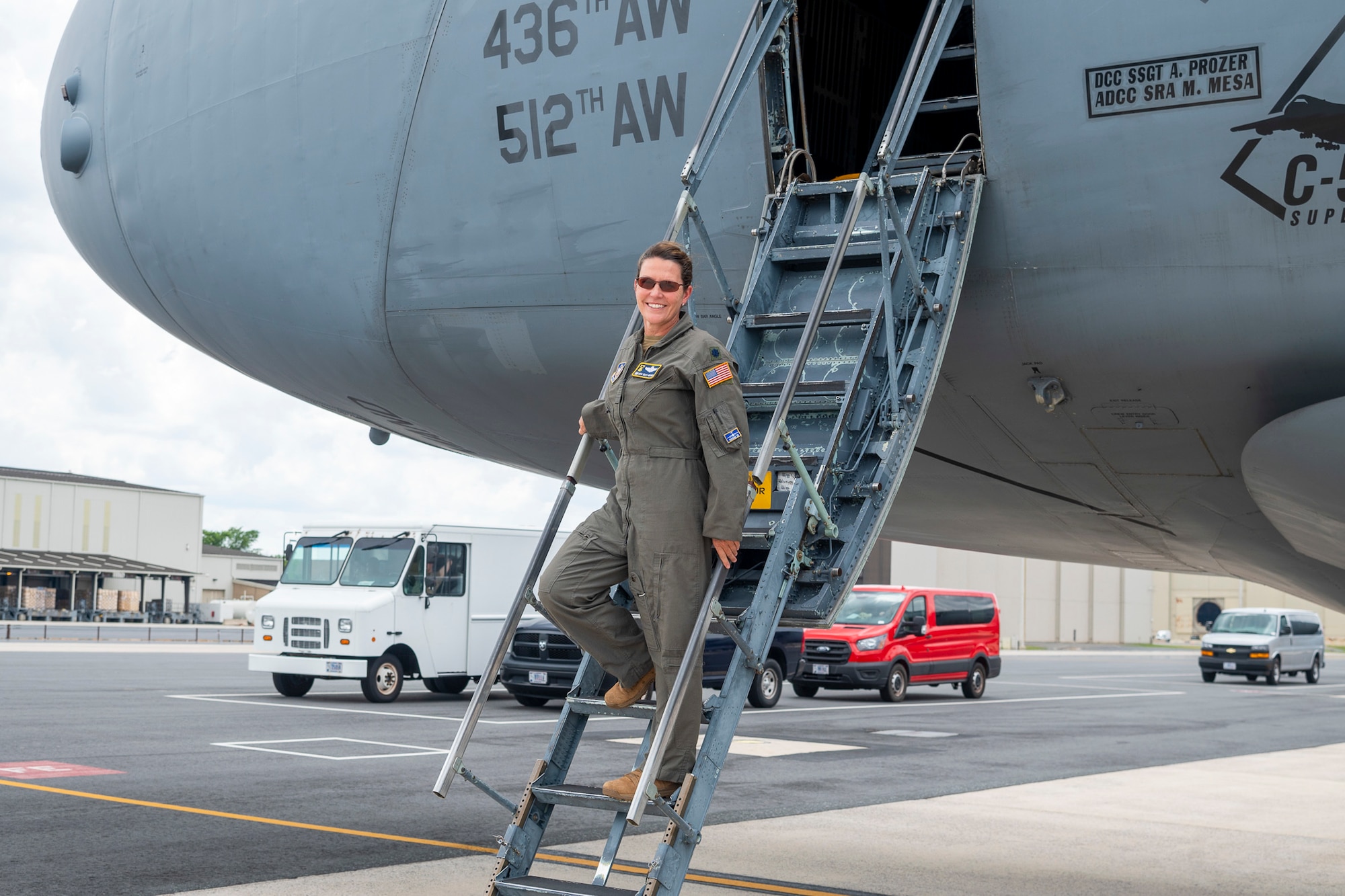 U.S. Air Force Lt. Col. Anita West-Werner, 512th Operations Group, Dover Air Force Base, Delaware, poses for a photo on the steps of a C-5M Super Galaxy June 7, 2022. West-Werner flew her final flight after 26 years with the 512th AW. West-Werner's next assignment is at the Pentagon in Arlington, Virginia, where she'll be the Individual Mobilization Augmentee to the Director of the Air Force Crisis Action Team. (U.S. Air Force photo by Mauricio Campino)