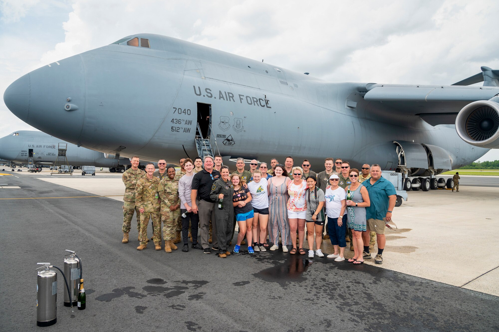 U.S. Air Force Lt. Col. Anita West-Werner, 512th Operations Group, Dover Air Force Base, Delaware, poses with air crew, family, and friends after her final flight June 7, 2022. West-Werner flew her final flight after 26 years with the 512th AW. West-Werner's next assignment is at the Pentagon in Arlington, Virginia, where she'll be the Individual Mobilization Augmentee to the Director of the Air Force Crisis Action Team. (U.S. Air Force photo by Mauricio Campino)