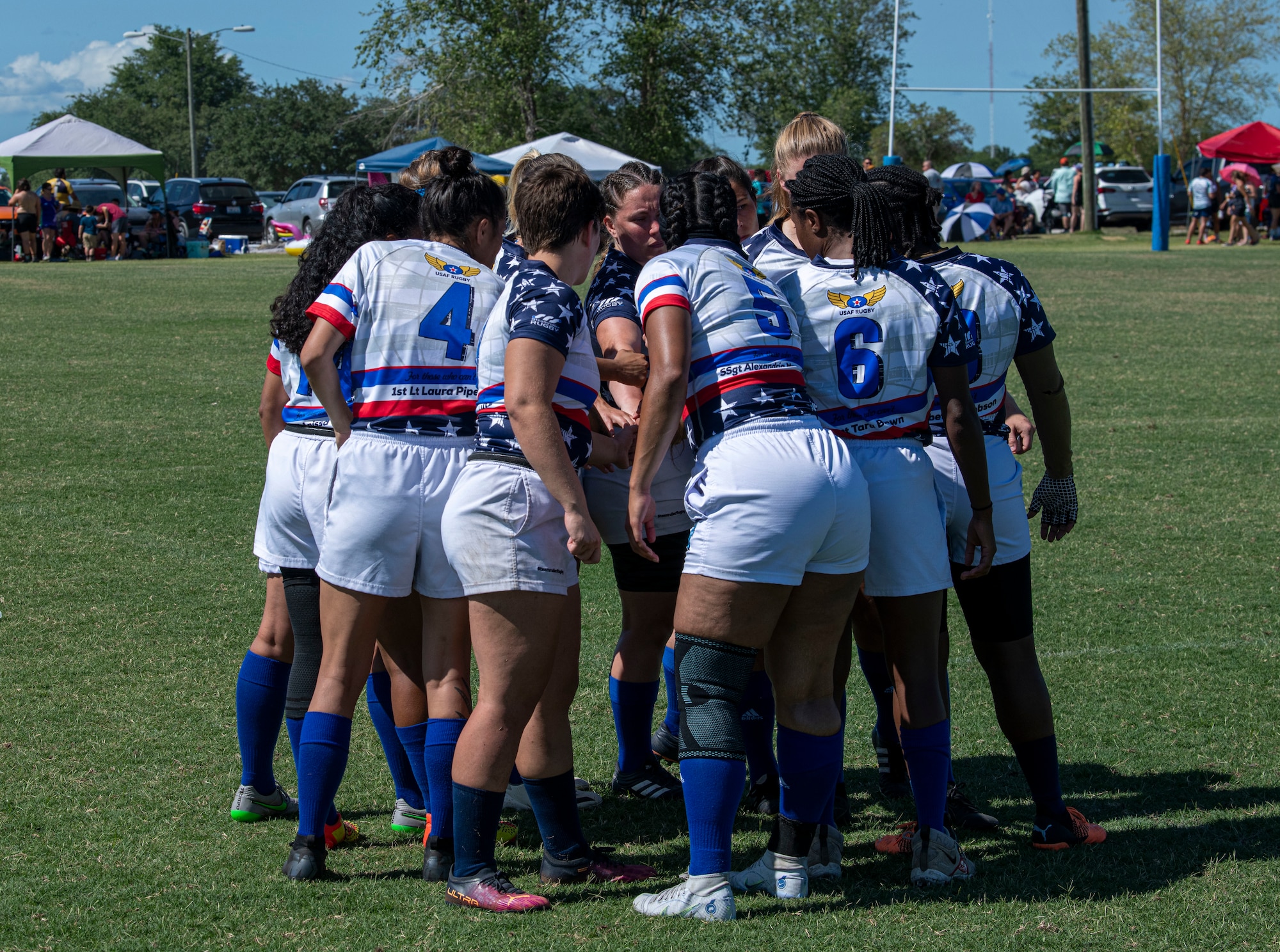Members of the Department of Air Force Women's Rugby Team huddles before the start of a game against the Northern Virginia Rugby Team after competing in the Annual Armed Forces Women’s Rugby Championship in Wilmington, North Carolina, June 26, 2022. The competition played rugby sevens, which means every team was made up of seven players playing 7-minute halves. (U.S. Air Force photo by Airman 1st Class Sabrina Fuller)