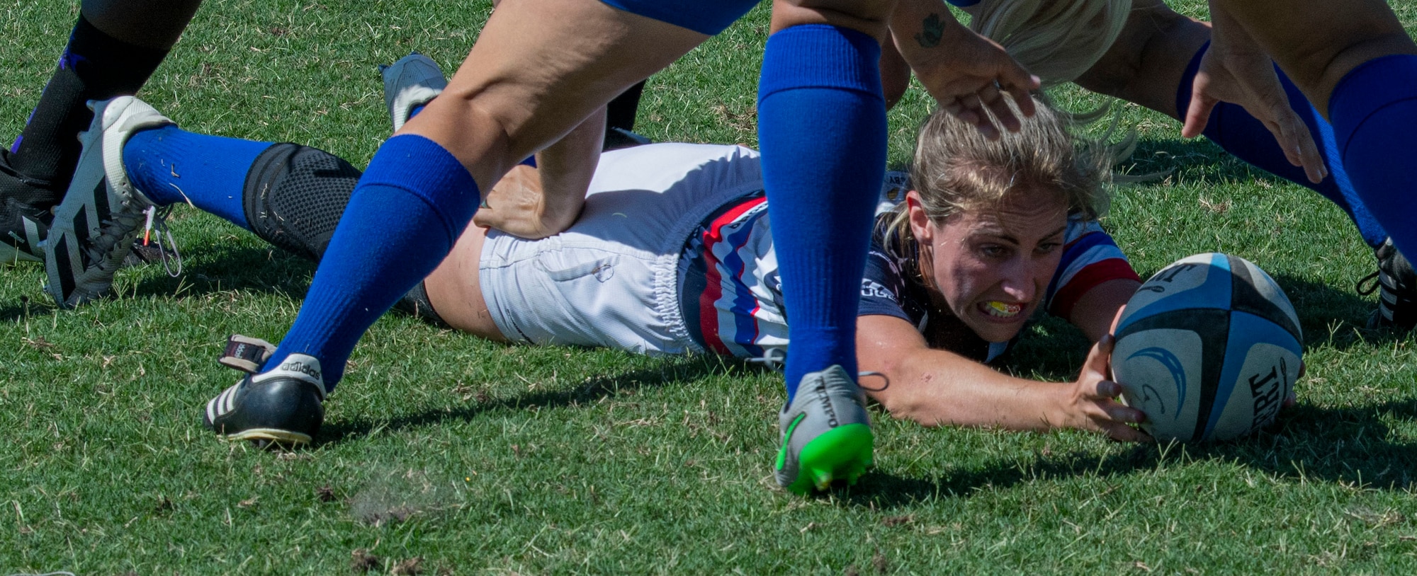 Capt. Joy Dewitt, 157th Operation Support Squadron boeing KC-46 pegasus mobility pilot and a member of the Department of Air Force Women’s Rugby Team, passes the ball during a game against the Northern Virginia Rugby Team after competing in the Annual Armed Forces Women’s Rugby Championship in Wilmington, North Carolina, June 26, 2022. The championship hosted the Coast Guard, Marine Corps, Navy, Army, Air Force and Space Force to compete in the tournament. (U.S. Air Force photo by Airman 1st Class Sabrina Fuller)