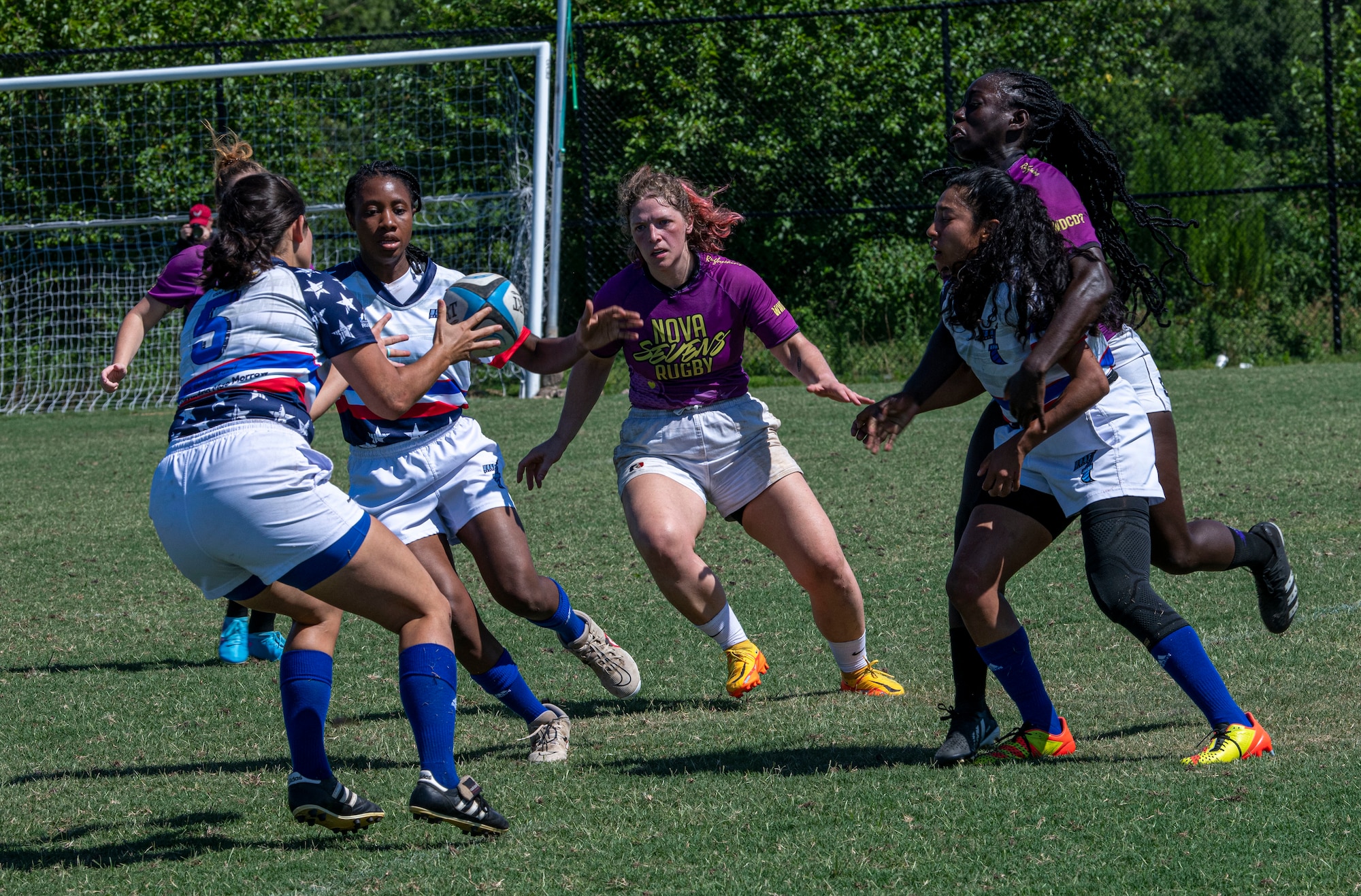 Members of the Department of Air Force Women's Rugby Team form an offensive strategy during a game against the Northern Virginia Rugby Team after competing in the Annual Armed Forces Women’s Rugby Championship in Wilmington, North Carolina, June 26, 2022. During the championship, the Air Force defeated the Navy 15 - 5, Coast Guard 22 -7 and Marine Corps 25 - 17. They lost their match to the Army, which placed the team second overall. (U.S. Air Force photo by Airman 1st Class Sabrina Fuller)