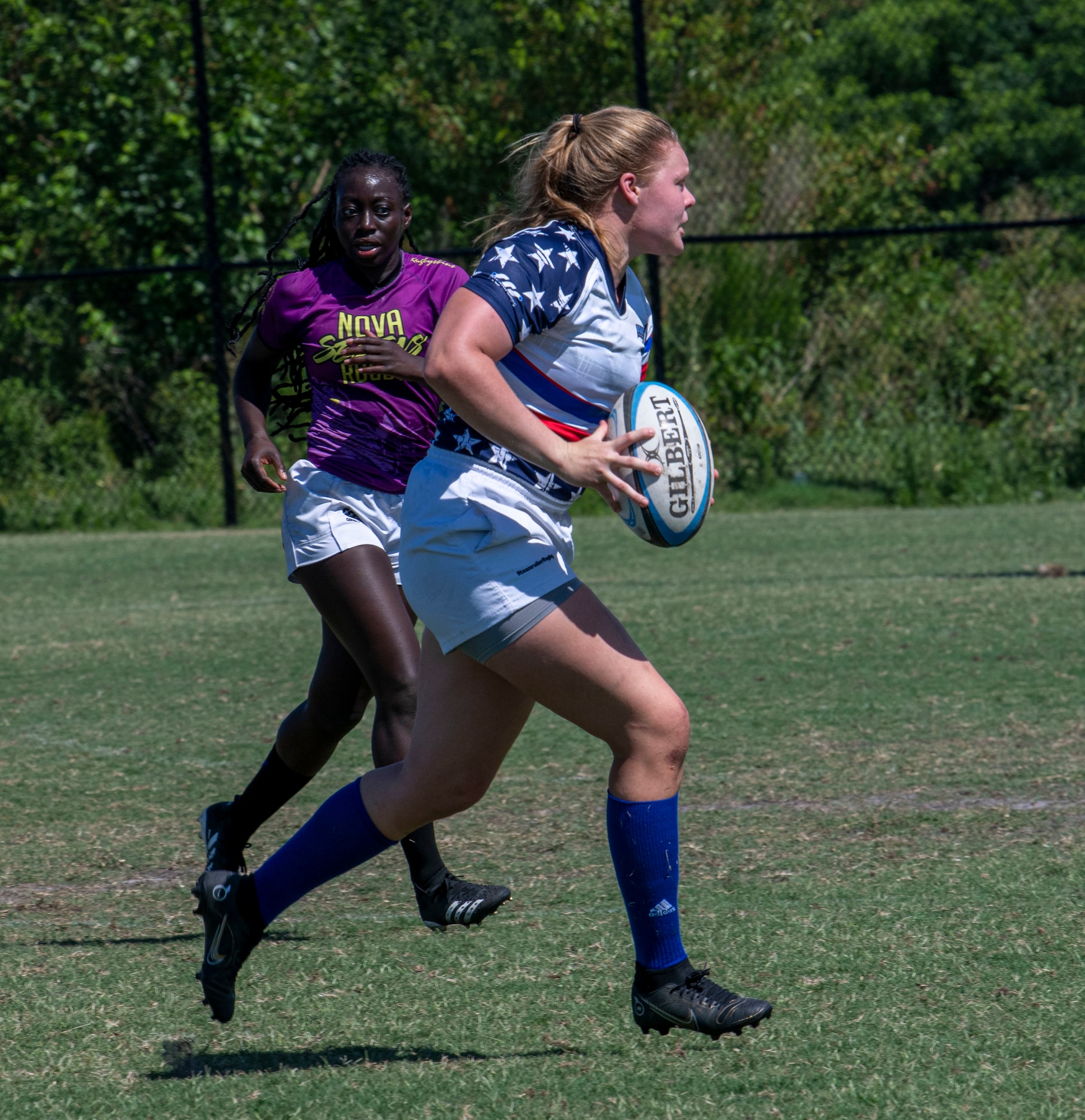 Senior Airman Nicole Mitchell, 433rd Civil Engineer Squadron emergency management apprentice and a member of the Department of Air Force Women’s Rugby Team, runs to the goal line during a game against the Northern Virginia Rugby Team after competing in the Annual Armed Forces Women’s Rugby Championship in Wilmington, North Carolina, June 26, 2022. The championship was hosted for three days with tournaments dedicated to the Armed Forces teams and civilian teams across the United States. (U.S. Air Force photo by Airman 1st Class Sabrina Fuller)