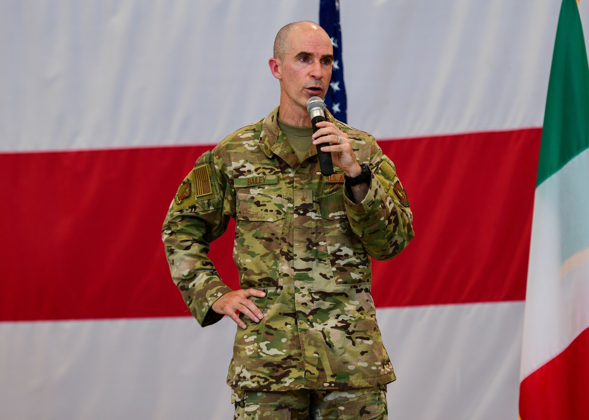 U.S. Air Force Brig. Gen. Jason Bailey, 31st Fighter Wing commander, speaks during his final all-call at Aviano Air Base, Italy, June 30, 2022. Commanders use all-calls to communicate important messages and highlight different accomplishments to the entire base populace. Bailey commands the only permanently assigned U.S. Air Force fighter aircraft wing in NATO’s southern region. (U.S. Air Force photo by Senior Airman Brooke Moeder)