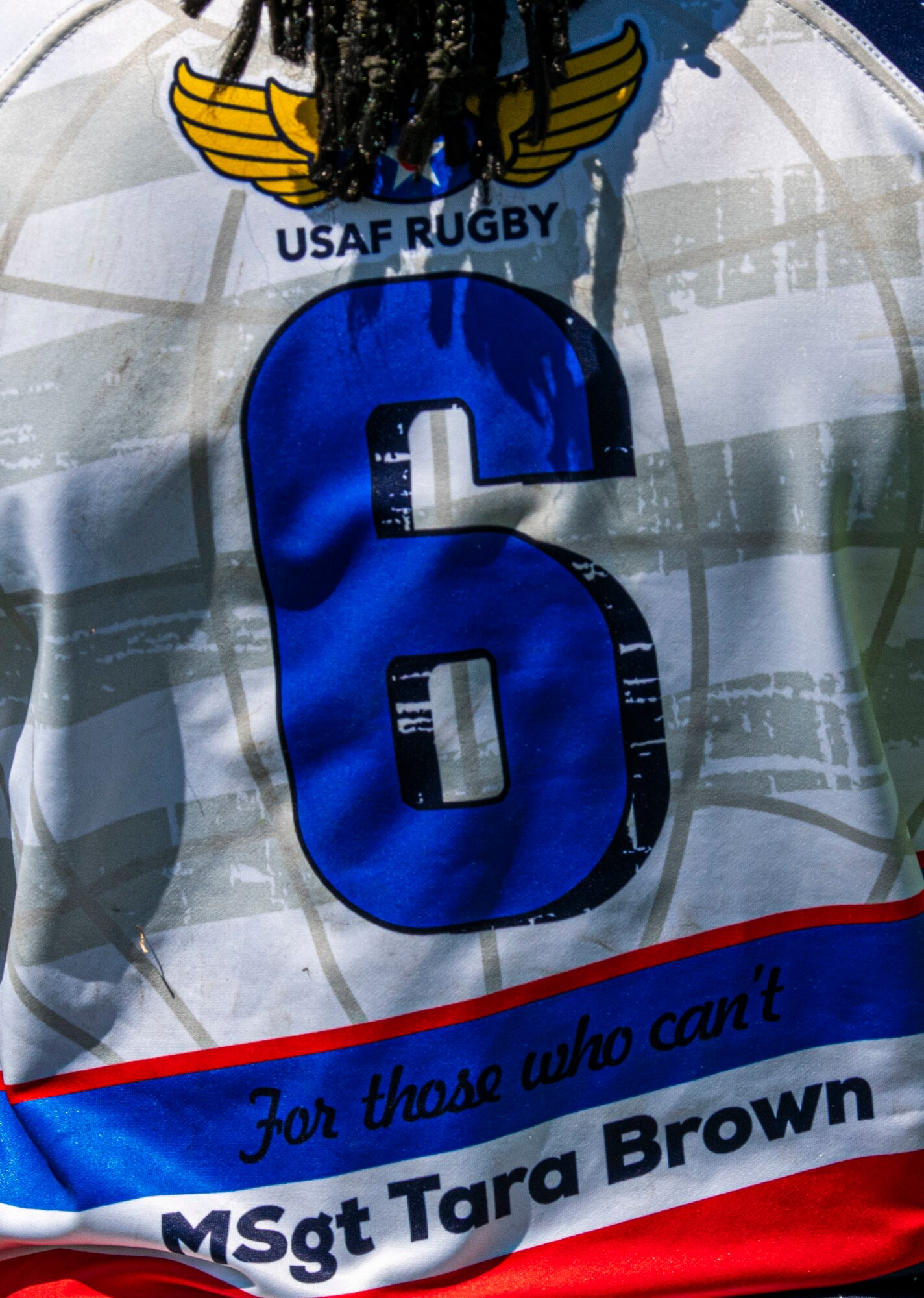 Tech Sgt. Cheryl Johnson, 89th Presidential Logistics Squadron supply technician and a member of the Department of Air Force Women’s Rugby Team, displays the name of a fallen Air Force service member on her back at the game against the Northern Virginia Rugby Team after competing in the Annual Armed Forces Women’s Rugby Championship in Wilmington, North Carolina, June 26, 2022. Each player wore a fallen service member's name on their shirts to remember those who died in the line of duty. (U.S. Air Force photo by Airman 1st Class Sabrina Fuller)
