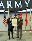 Brig. Gen. Christopher Schneider receives the charter as Program Executive Officer, PEO Soldier, from Assistant Secretary of the Army for Acquisition, Logistics, and Technology Mr. Douglas Bush, at Fort Belvoir, Virginia, June 21, 2022