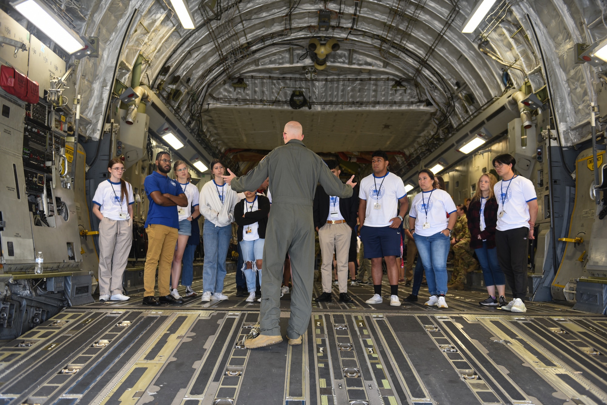 Northwest Youth Leadership Conference attendees receive a tour of a C-17 Globemaster III as part of Aviation Inspiration and Mentorship (AIM) Wing event at Joint Base Lewis-McChord, Washington, June 28, 2022. AIM Wing is a community outreach program to inform, influence and inspire the next generation of Air Force aviators. (U.S. Air Force photo by Master Sgt Julius Delos Reyes)