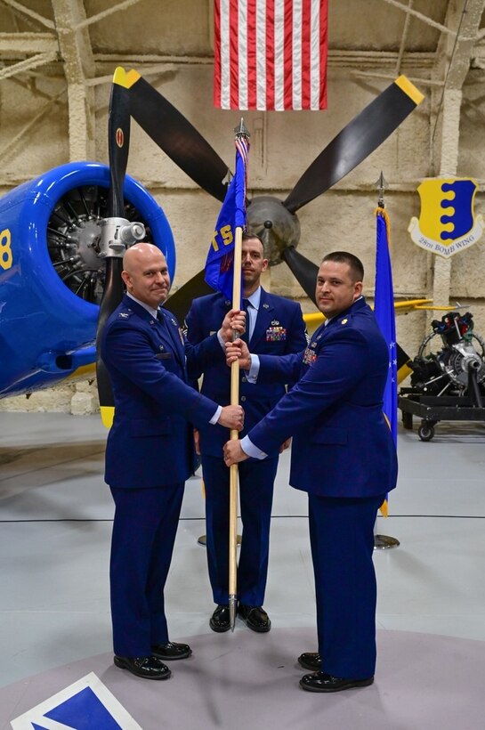 Maj. Nicholas DeFranco, the incoming 28th Comptroller Squadron commander, receives the 28th Comptroller Squadron guidon at Ellsworth Air Force Base, S.D., June 29, 2022.