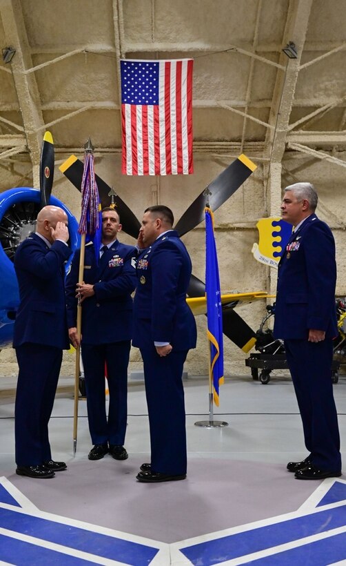Col. Joseph Sheffield, the 28th Bomb Wing commander, left, Maj. Nicholas DeFranco, the 28th Comptroller Squadron incoming commander, middle, and Lt. Col. Kenneth Byrd, the 28th Comptroller Squadron outgoing commander, right, stand perform a change of command ceremony at Ellsworth Air Force Base, S.D., June 24, 2022.