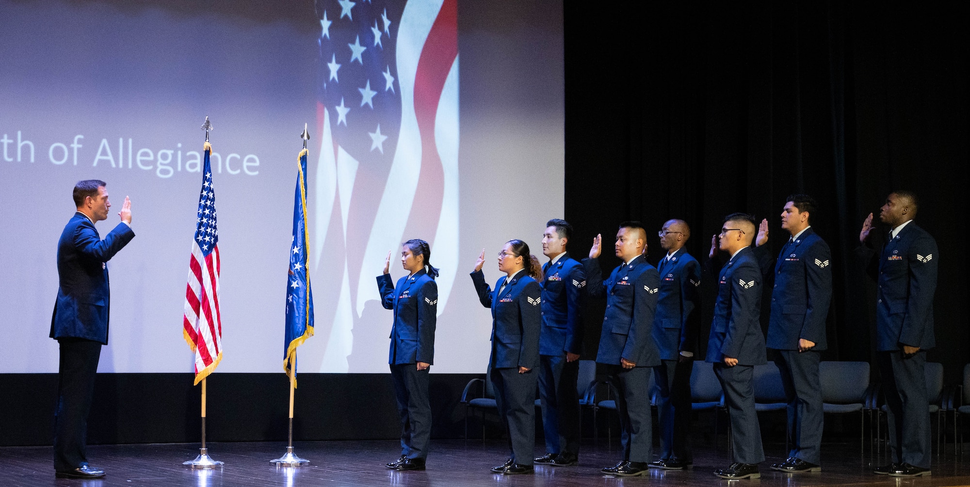 Airmen raise their hands