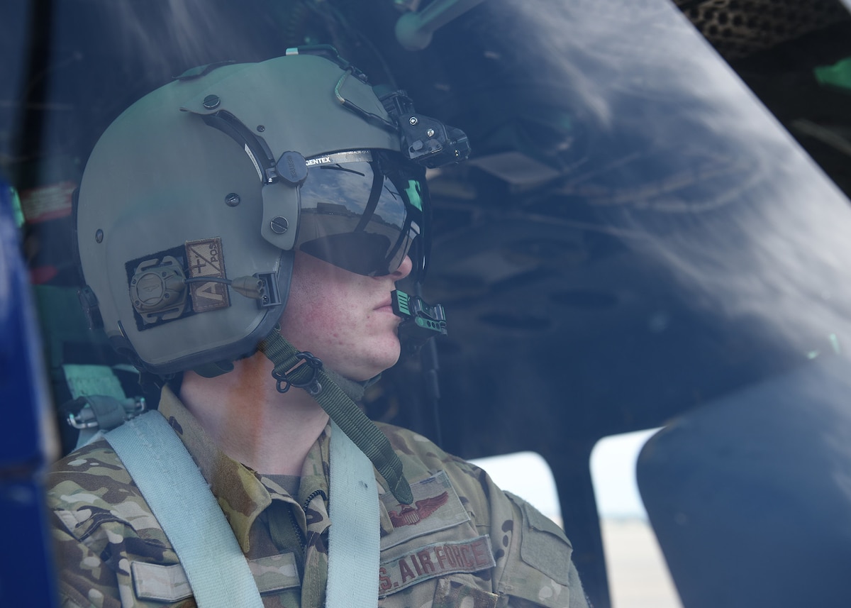 Maj. Jason Vero, Joint Base Andrews Air Show director, poses for a photo inside the cockpit of a UH-1N Huey on the flight line at Joint Base Andrews, Md., June 28, 2022. (U.S. Air Force photo by Airman 1st Class Matthew-John Braman)