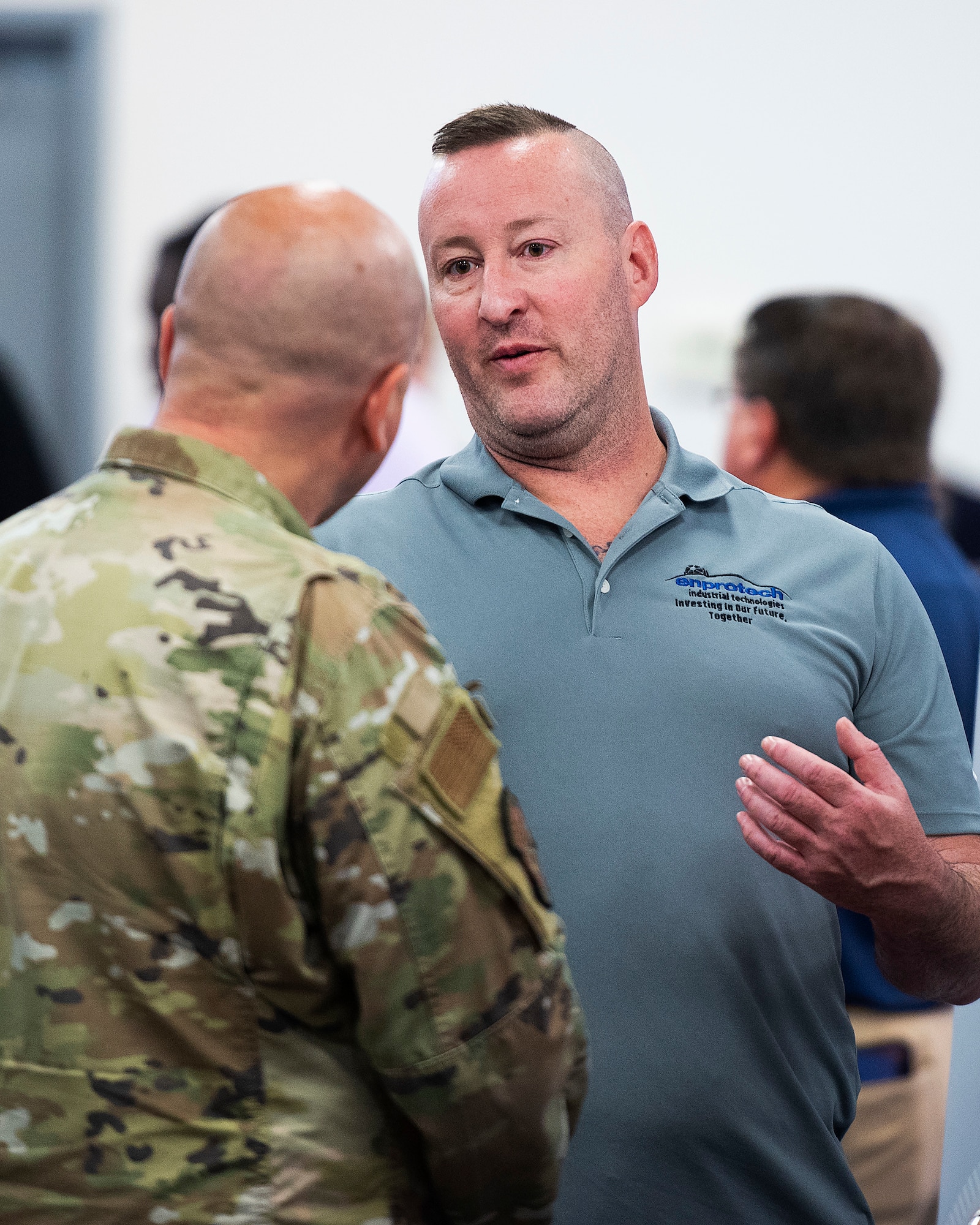 Matt Greider, a veteran now working for Enprotech, talks with Senior Master Sgt. Joshua Stephenson, 88th Security Forces Squadron, about career opportunities during the Hire Our Heroes event June 22, 2022, at the Hope Hotel, Wright-Patterson Air Force Base, Ohio. Enprotech, a company that supports the steel industry by repairing equipment, was looking for Airmen about to separate, or who have recently separated, from the service to fill positions with the company. (U.S. Air Force photo by R.J. Oriez)