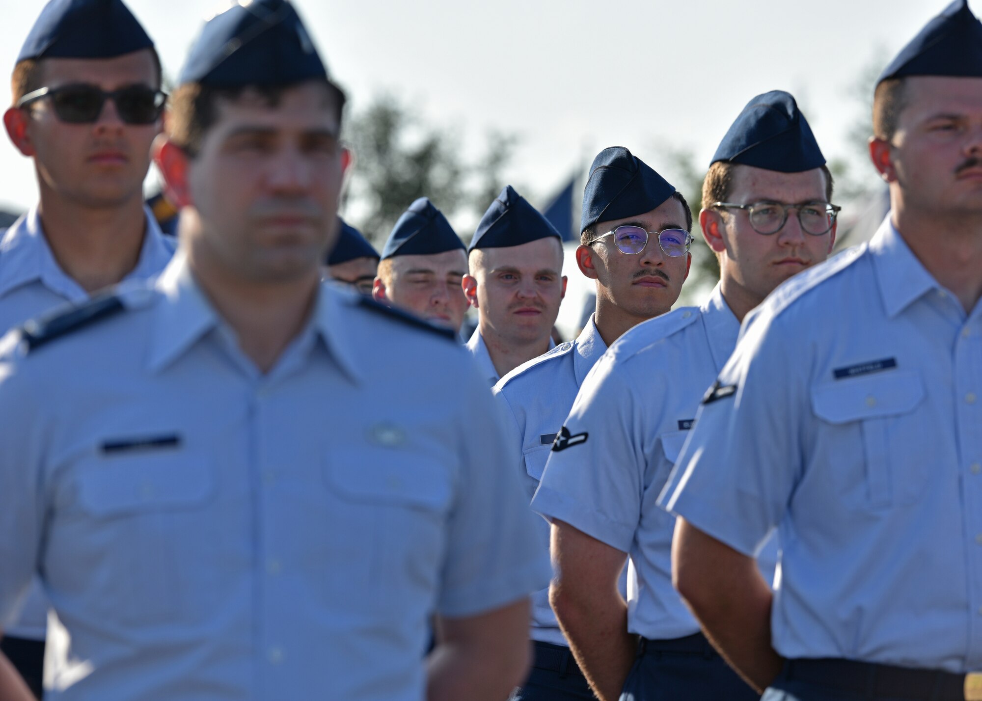 Members of the 17th Training Group stand in formation during the 17th TRG change of command at Goodfellow Air Force Base, Texas, June 30, 2022. Over 350 Airmen, Soldiers, Sailors, Marines, Coast Guardsmen, and Guardians stood in formation for the change of command. (U.S. Air Force photo by Senior Airman Ashley Thrash)