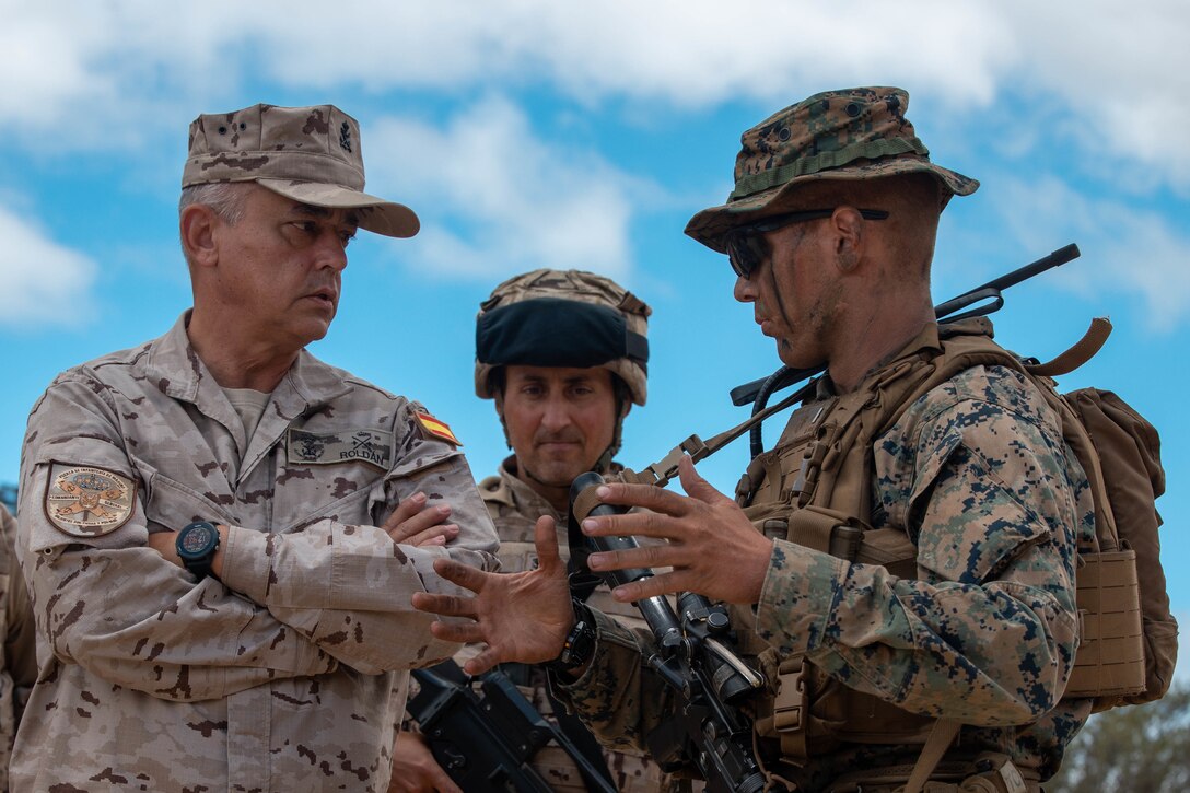 U.S. Marine Corps 1st Lt. Joseph Moskal, a platoon commander with 1st Battalion, 8th Marine Regiment, 2d Marine Division, meets with General de División de Infantería de Marina Marina Rafael Roldán Tudela, Comandante General de la Infantería with Tactical Group Fox, during Spanish FLOTEX-22 near Rota, Spain, June 22, 2022. This exercise features tactical level actions ashore, combined with joint training and planning, aimed at increasing overall bilateral interoperability between nations. (U.S. Marine Corps photo by Lance Cpl. Megan Ozaki)
