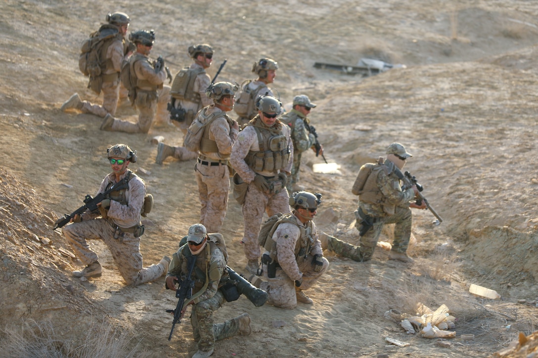 U.S. Marines and Tunisian Armed Forces advance through a valley during rehearsal for a live-fire exercise as part of African Lion 22 in the Ben Ghilouf Training Area, Tunisia, June 24, 2022. African Lion 2022 is U.S. Africa Command's largest, premier, joint, annual exercise hosted by Morocco, Ghana, Senegal and Tunisia, June 6 - 30. More than 7,500 participants from 28 nations and NATO train together with a focus on enhancing readiness for U.S. and partner nation forces. AL22 is a joint all-domain, multi-component, and multinational exercise, employing a full array of mission capabilities to strengthen interoperability among participants and set the theater for strategic access. (U.S. Army photo by Staff Sgt. Brandon Jacobs, 105th Mobile Public Affairs Detachment)