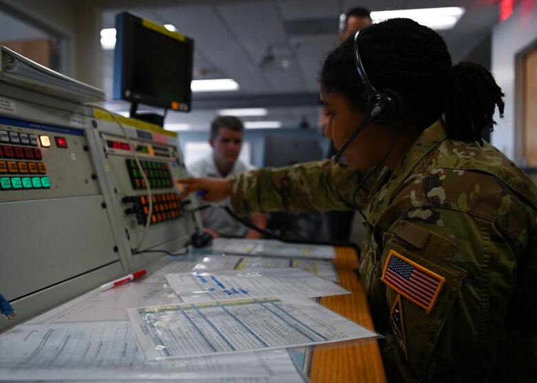 2nd Lt. Taylor Latimer, 2nd Range Operations Squadron range operations commander, walks industry partners through a simulated console exercise at Vandenberg Space Force Base, Calif., June 24, 2022. The console exercise demonstrated how the members at 2ROPS communicate with different parties to get real-time information during space launches. (U.S. Space Force photo by Airman 1st Class Tiarra Sibley)