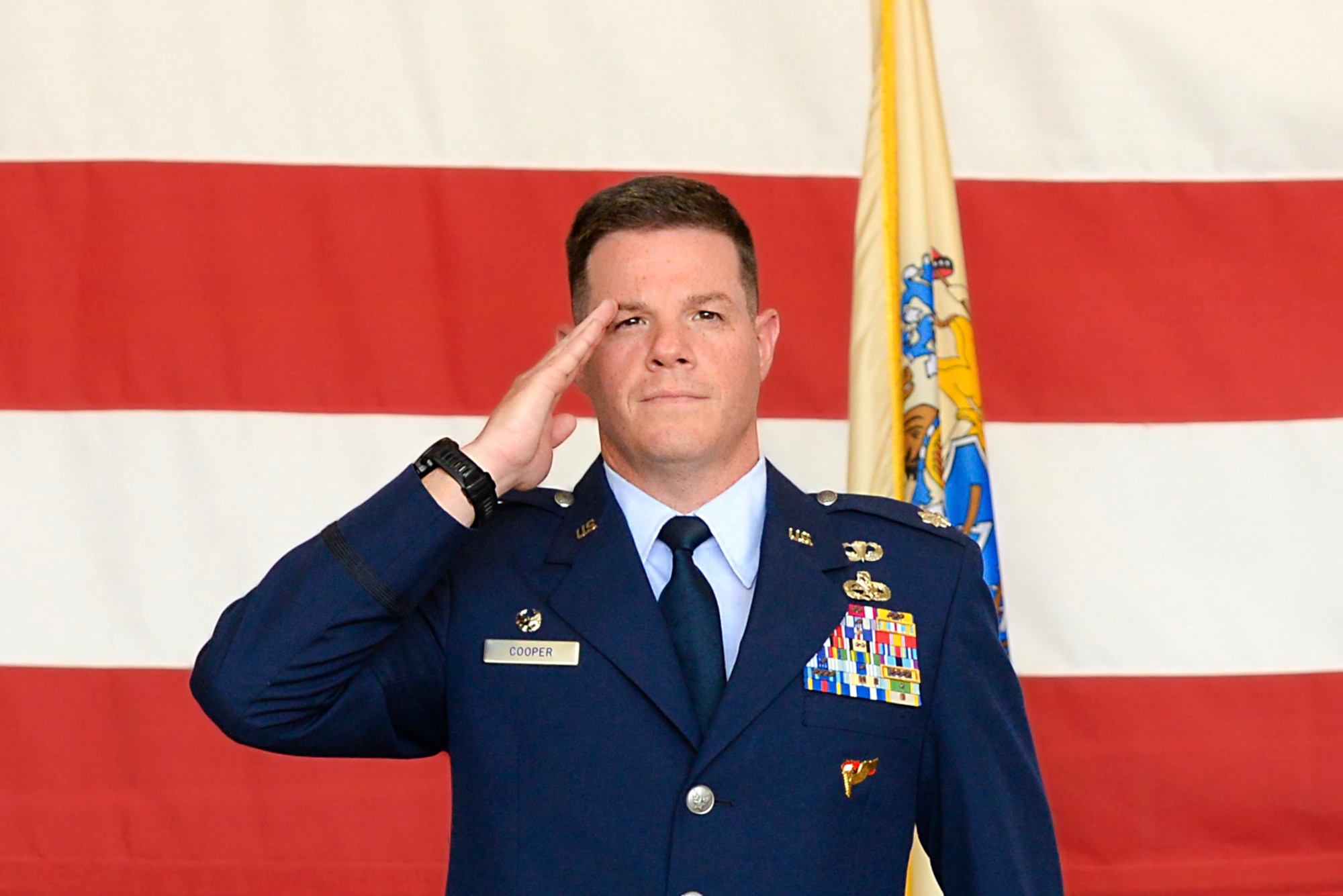 Lt. Col. Brian Cooper renders his first salute to the 177th MXG during its Change of Command ceremony