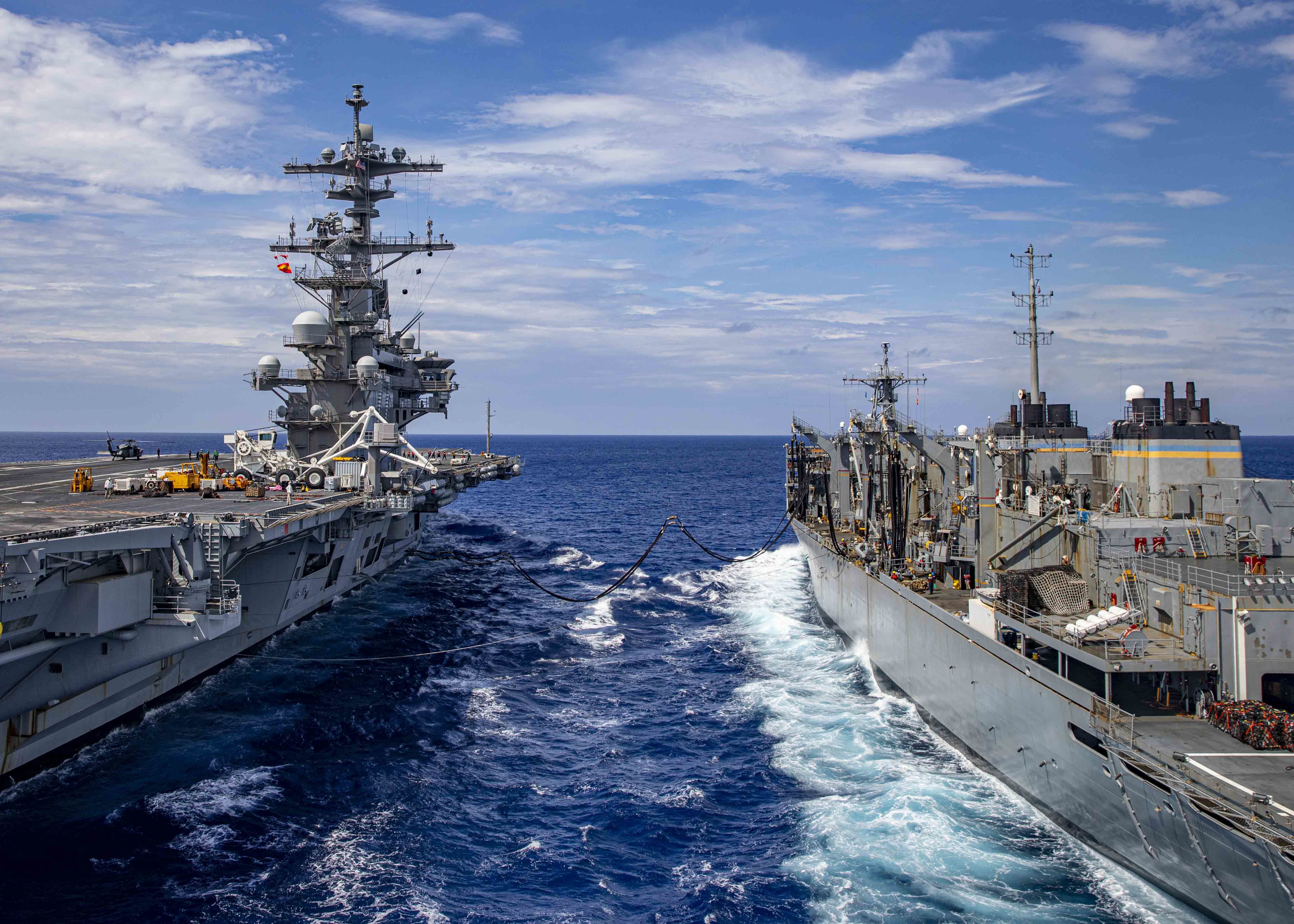 USS George H.W. Bush (CVN 77) participates in a replenishment-at-sea with the Military Sealift Command fast combat support ship USNS Arctic (T-AO 195), June 28, 2022.