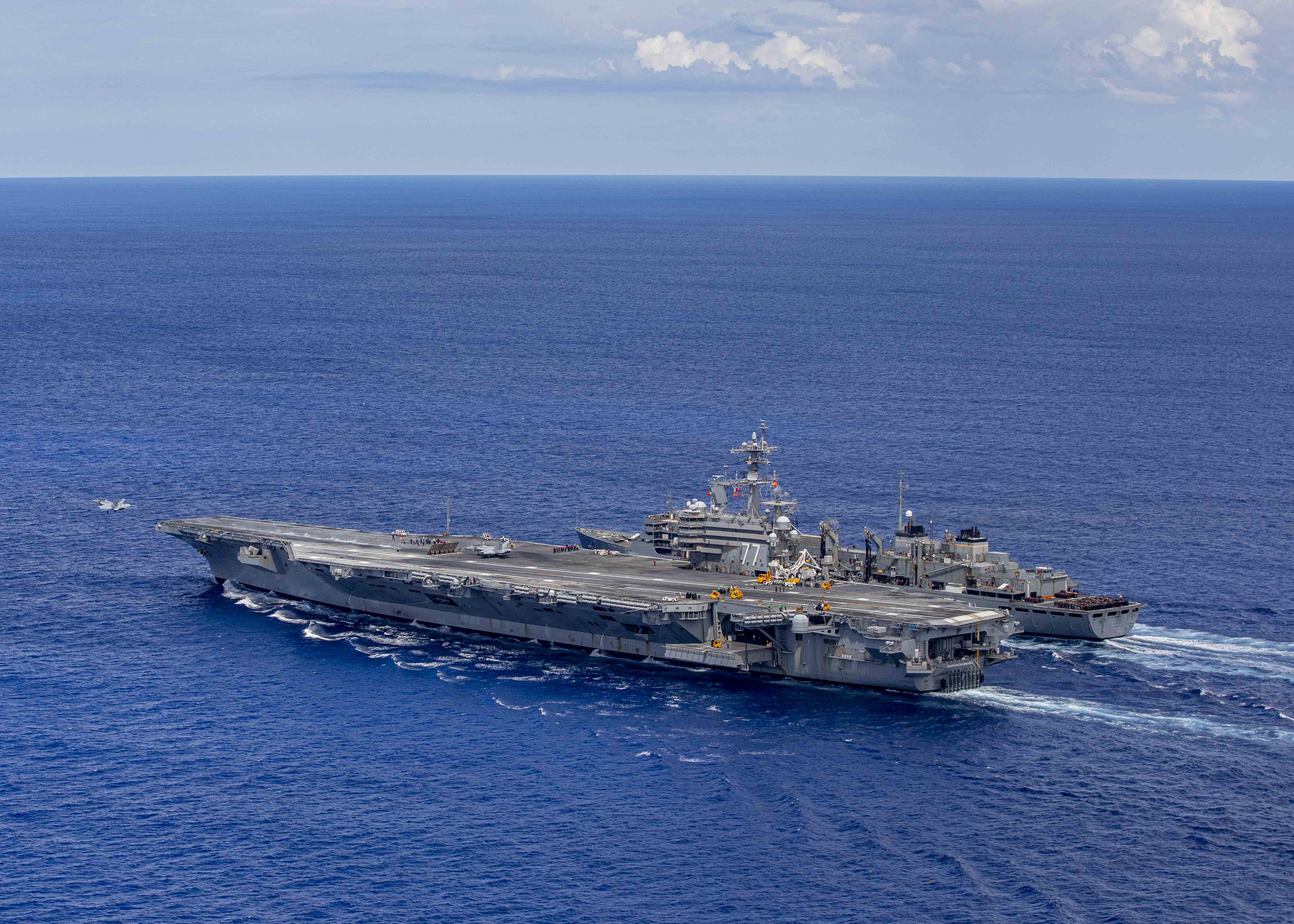 The Nimitz-class aircraft carrier USS George H.W. Bush (CVN 77) launches an F/A-18F Super Hornet aircraft, attached to Strike Fighter Squadron (VFA) 103, during a replenishment-at-sea with the fast combat support ship USNS Arctic (T-AO 195), June 28, 2022.