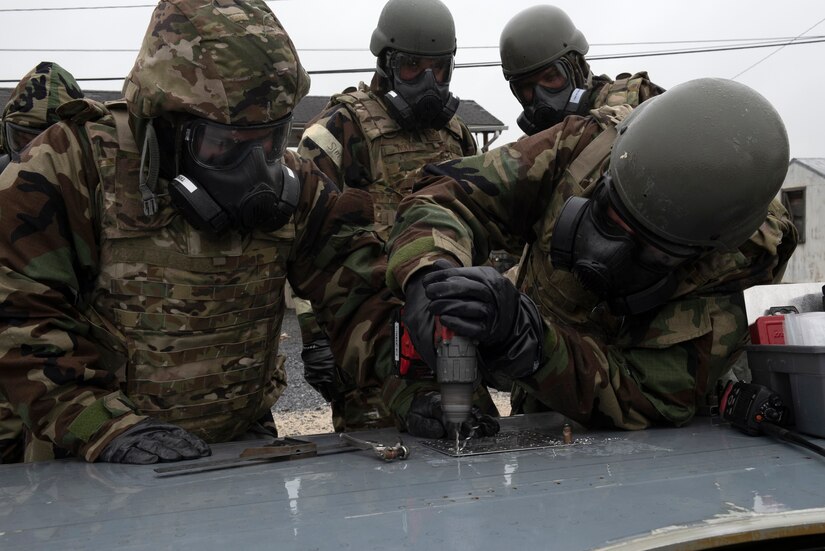 193rd Special Operations Aircraft Maintenance Squadron Airmen from Middletown, Pennsylvania Air National Guard, repair a hole in a wing of a C-130 during a training exercise held at Fort Indiantown Gap, Annville, Pennsylvania June 23, 2022.