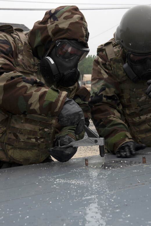 193rd Special Operations Aircraft Maintenance Squadron Airmen from Middletown, Pennsylvania Air National Guard, place rivets into a metal patch on a C-130 wing to repair a hole during a training exercise held at Fort Indiantown Gap, Annville, Pennsylvania June 23, 2022.