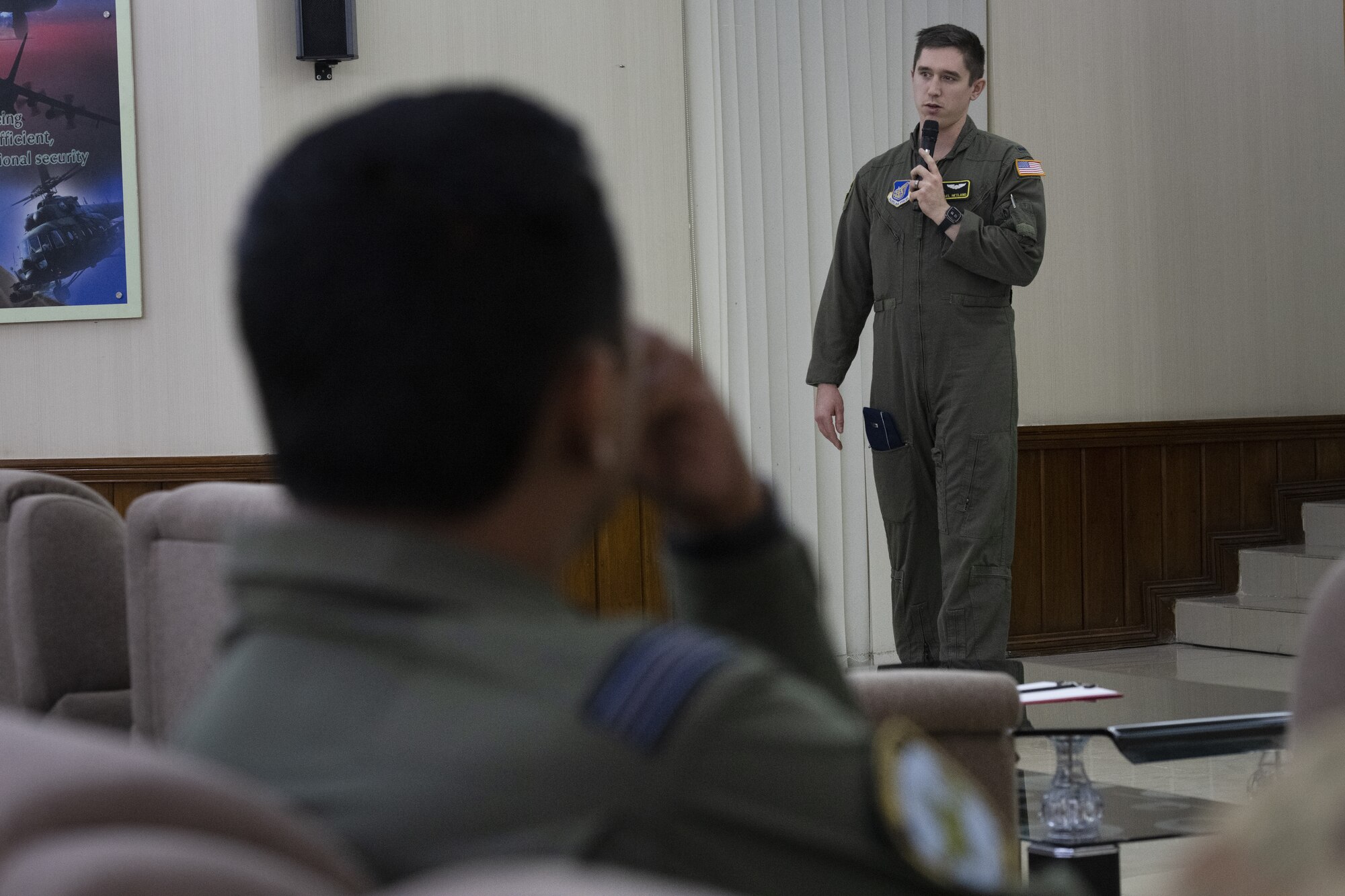 U.S. Air Force 1st Lt. Michael Hetland, 36th Expeditionary Airlift Squadron C-130J Super Hercules pilot, briefs Bangladesh air force (BAF) aircrew on C-130 capabilities during a subject matter exchange event as part of Exercise Cope South 2022, Feb. 19, 2022, at BAF Base Bangabandhu, Bangladesh. Discussions during the SME event also included best practices on low level flight, aircrew flight equipment nomenclature and crew resource management. Exercise Cope South is a Pacific Air Forces-sponsored bilateral tactical airlift exercise designed to enhance the interoperability between the U.S. Air Force and BAF. (U.S. Air Force photo by Tech. Sgt. Christopher Hubenthal)