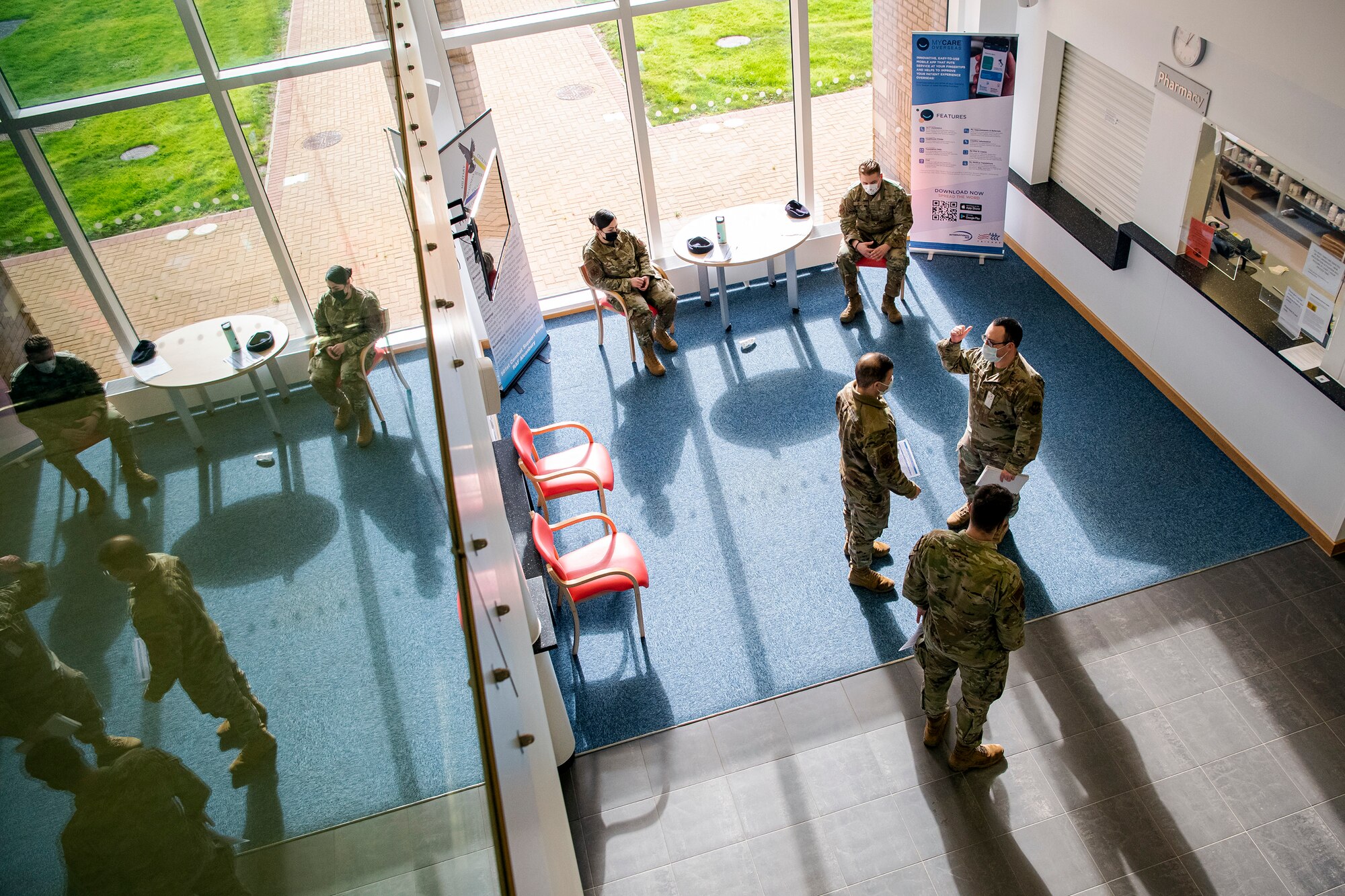 Airmen from the 423rd Security Forces Squadron wait in the lobby of the 423rd Medical Squadron during their pre-deployment out-processing at RAF Alconbury, England, Feb. 24, 2022. The SFS members are preparing to deploy in support of a joint response to conduct operations focused on bolstering the posture of NATO’s eastern flank. (U.S. Air Force photo by Senior Airman Eugene Oliver)