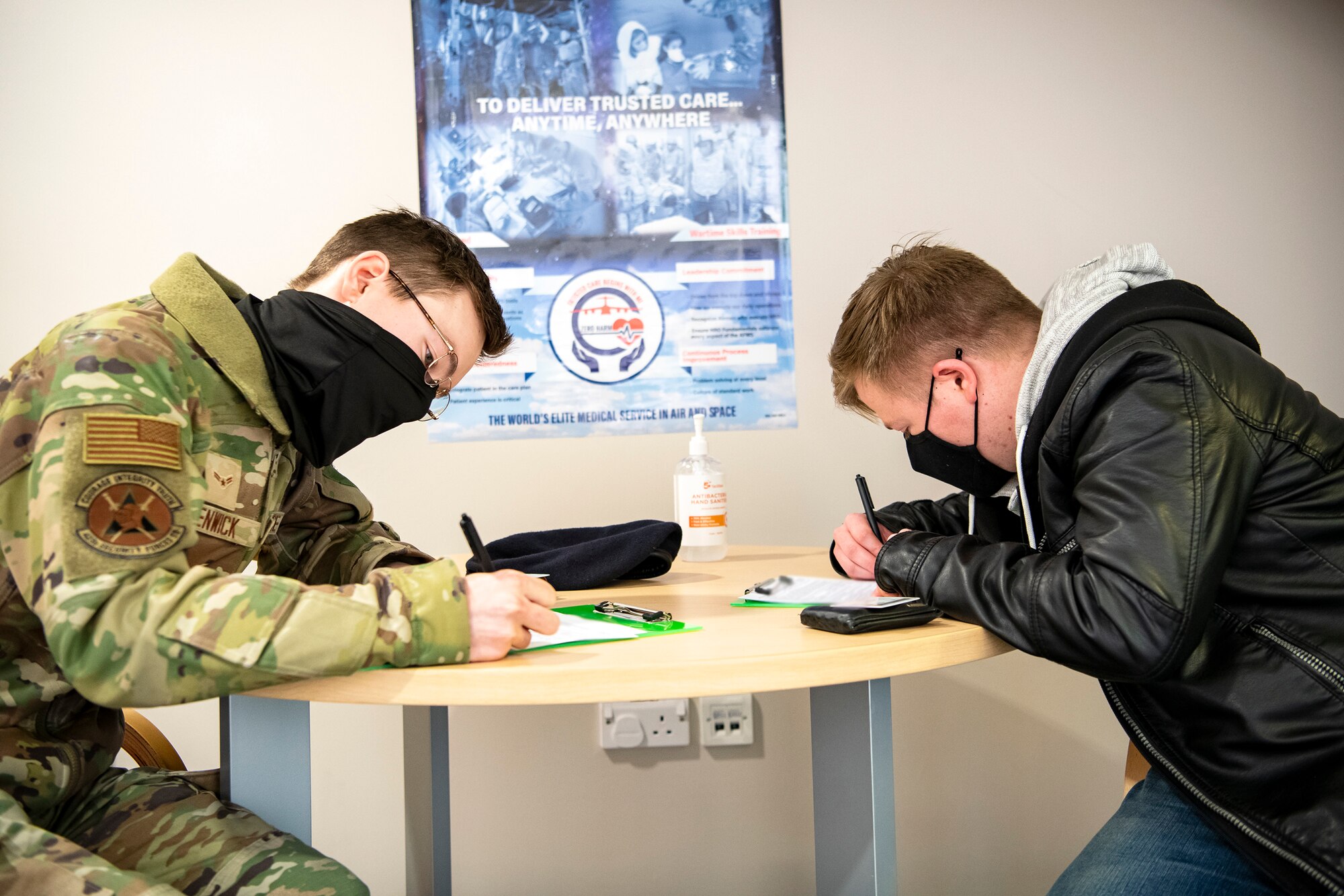 Airmen from the 423rd Security Forces Squadron complete paperwork as part of their pre-deployment out-processing at RAF Alconbury, England, Feb. 24, 2022. Several SFS members are preparing to deploy in support of a joint response to conduct operations focused on bolstering the posture of NATO’s eastern flank. (U.S. Air Force photo by Senior Airman Eugene Oliver)