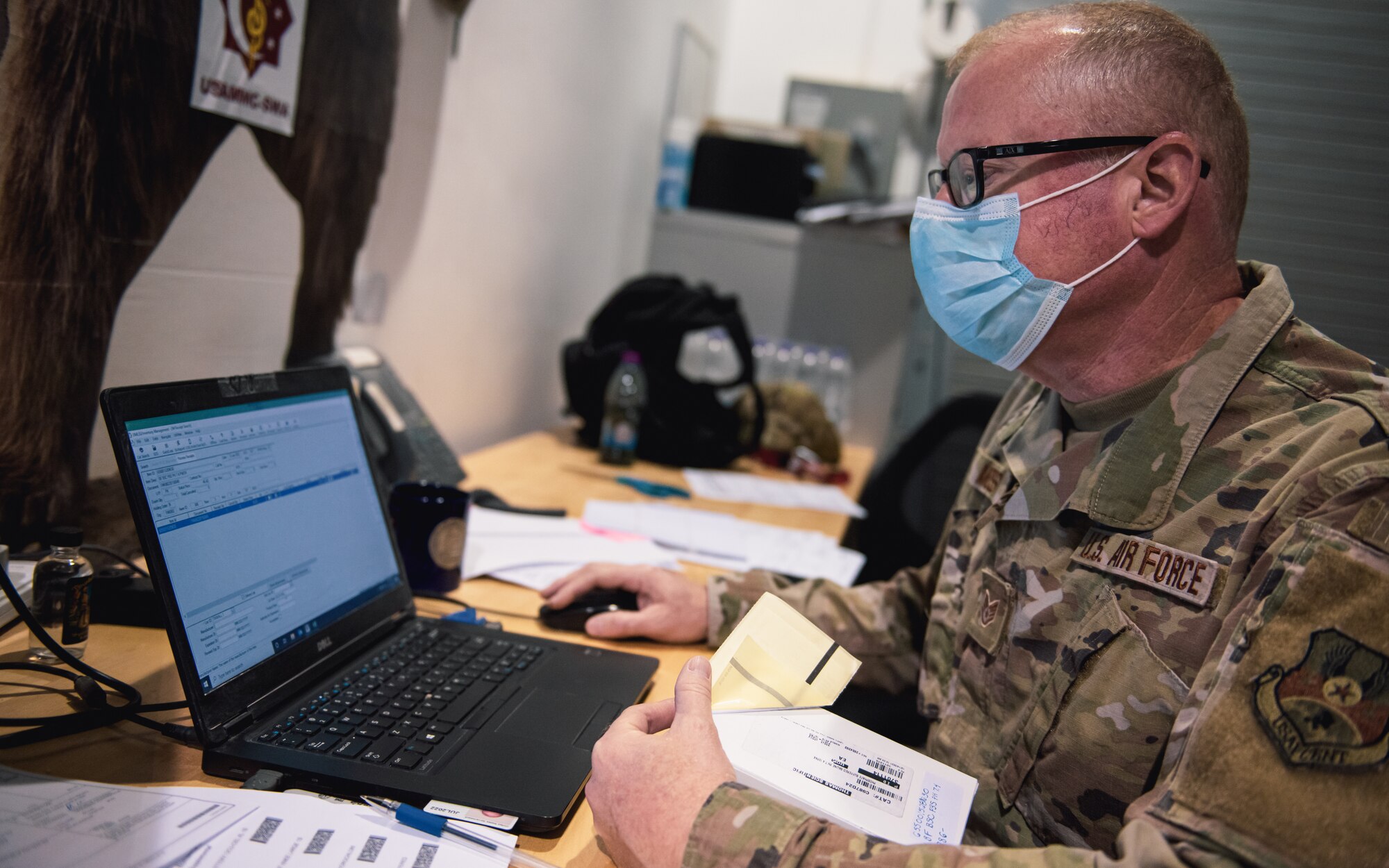 Airman uses computer.
