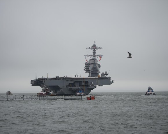USS Gerald R. Ford (CVN 78) departs Newport News Shipyard after completing the industrial portion of a six-month Planned Incremental Availability (PIA), Feb. 25, 2022.