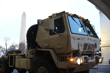 A District of Columbia Army National Guard Light Medium Tactical Vehicle sits at a D.C. Metropolitan Police Department (MPD)-designated traffic control point near the Washington Monument, Washington, D.C. on Feb. 28, 2022. The National Guard has been activated to support MPD and U.S. Capitol Police requests for assistance in anticipation of First Amendment demonstrations in the city. (U.S. Army National Guard photo by Sgt. Richard Trinh)